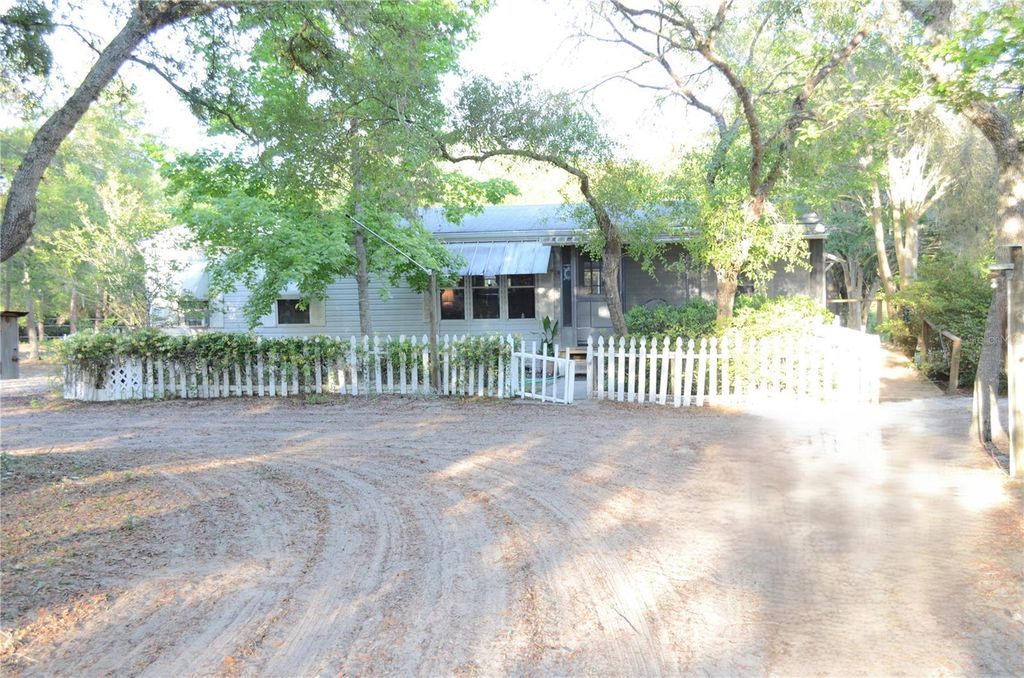 Photo of 591 SE Fisher Road, Ocklawaha, FL 32179 (MLS # OM722975)