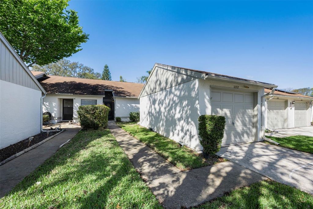 Photo of 11717 Spring Tree Lane, Port Richey, FL 34668 (MLS # TB8482203)