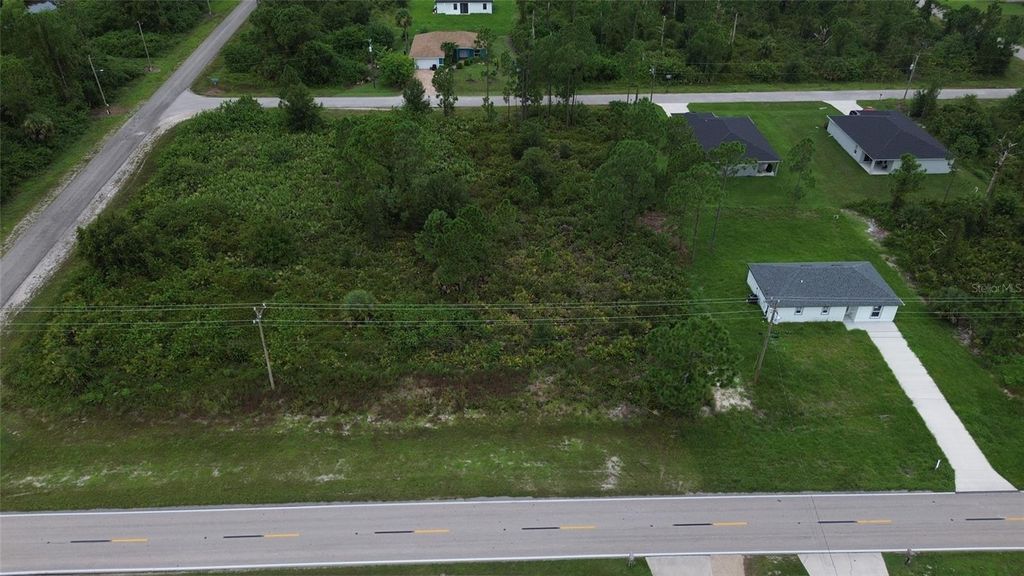 Photo of 464 Columbus Blvd, Lehigh Acres, FL 33974 (MLS # O6342815)