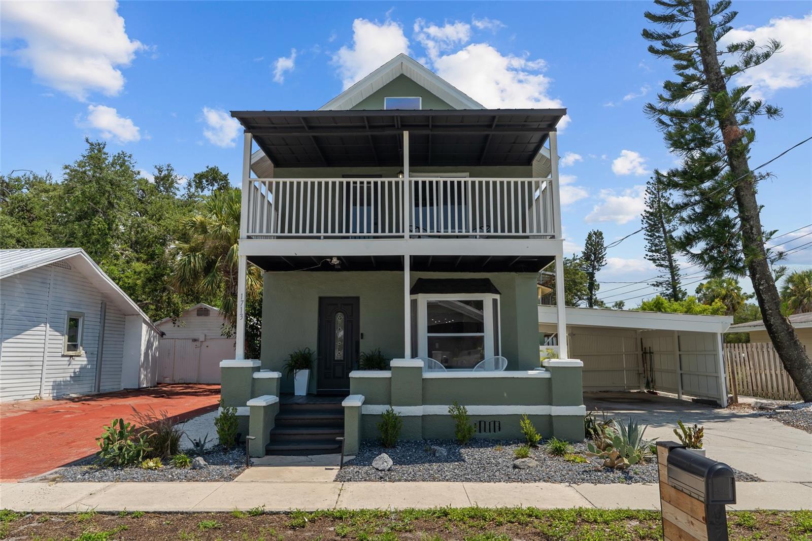 Welcome to historic Bradenton living! This 1911 four-bedroom, three-bath home is the epitome of "vintage charm with modern flair." WALKING DISTANCE to Downtown Bradenton, the Village of the Arts, the scenic Riverwalk, and more. If that isn't enough, it’s also less than 10 miles from Anna Maria Island’s pristine beaches that are consistently ranked as some of the top in the nation. On top of that, seller is offering 7k towards buyers CLOSING COSTS AND PRE PAIDS!
Step through the antique wood and frosted-glass front door into an open, sunlit living area that flows seamlessly into the dining space and remodeled kitchen. The kitchen is a chef’s dream, boasting granite counter tops, stainless steel appliances, rich wood cabinetry, a brand-new gas range, a handy walk-in pantry/ wine cellar, and a breakfast bar style counter. On the first floor, a private bedroom suite (currently used as an office) features its own updated en-suite bath for guests as well as a designated laundry area.
Upstairs are three more bedrooms and two baths. The guest bathroom has been stylishly renovated with new tile, sleek fixtures, and a modern vanity. One bedroom (currently set up as a study area) includes its own balcony and unique spiral staircase leading up to a loft/ den area. It also features a balcony with lounging chairs, perfect for morning coffee or curling up with a book. The other guest bedroom has been recently painted and new light fixtures have been added.
The large primary suite is a peaceful retreat with a newly redone walk-in closet and a spa-like bath featuring travertine tile, granite countertops, and dual vessel sinks. This home has AMPLE storage space throughout. Recent updates bring peace of mind: Hunter Douglas custom window treatments, fresh paint inside and out (2025), freshly landscaped (2024), a new AC unit and repaired ductwork (2024), and a roof replaced in 2023. The house sits high and dry (no flood insurance needed), with easy commutes to St. Petersburg (30 minutes) and Tampa (45 minutes). Just steps away, the Bradenton farmers market happens every Saturday and new neighborhood favorites like Taverna Toscana, Good Liquor Brewing and Shuck It add a dash of flavor to daily life. This could also be a perfect property for an investor looking to add to their portfolio - as there are many successfully ran short term rentals in this area as well. Whether it’s an evening stroll along the river or a weekend at the beach, this home mixes historic character with cozy beachy vibes—truly the best of Florida living.