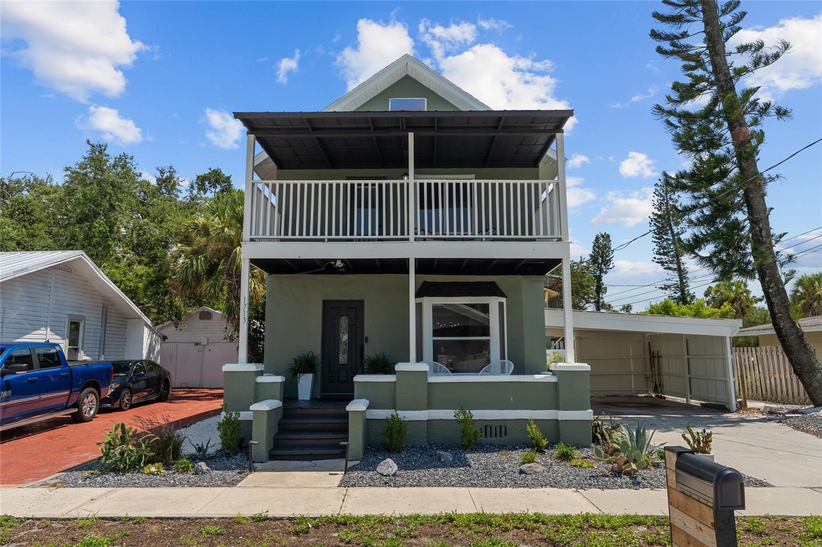 Welcome to historic Bradenton living! This 1911 four-bedroom, three-bath home is the epitome of "vintage charm with modern flair." WALKING DISTANCE to Downtown Bradenton, the Village of the Arts, the scenic Riverwalk, and more. If that isn't enough, it’s also less than 10 miles from Anna Maria Island’s pristine beaches that are consistently ranked as some of the top in the nation. On top of that, seller is offering 7k towards buyers CLOSING COSTS AND PRE PAIDS!
Step through the antique wood and frosted-glass front door into an open, sunlit living area that flows seamlessly into the dining space and remodeled kitchen. The kitchen is a chef’s dream, boasting granite counter tops, stainless steel appliances, rich wood cabinetry, a brand-new gas range, a handy walk-in pantry/ wine cellar, and a breakfast bar style counter. On the first floor, a private bedroom suite (currently used as an office) features its own updated en-suite bath for guests as well as a designated laundry area.
Upstairs are three more bedrooms and two baths. The guest bathroom has been stylishly renovated with new tile, sleek fixtures, and a modern vanity. One bedroom (currently set up as a study area) includes its own balcony and unique spiral staircase leading up to a loft/ den area. It also features a balcony with lounging chairs, perfect for morning coffee or curling up with a book. The other guest bedroom has been recently painted and new light fixtures have been added.
The large primary suite is a peaceful retreat with a newly redone walk-in closet and a spa-like bath featuring travertine tile, granite countertops, and dual vessel sinks. This home has AMPLE storage space throughout. Recent updates bring peace of mind: Hunter Douglas custom window treatments, fresh paint inside and out (2025), freshly landscaped (2024), a new AC unit and repaired ductwork (2024), and a roof replaced in 2023. The house sits high and dry (no flood insurance needed), with easy commutes to St. Petersburg (30 minutes) and Tampa (45 minutes). Just steps away, the Bradenton farmers market happens every Saturday and new neighborhood favorites like Taverna Toscana, Good Liquor Brewing and Shuck It add a dash of flavor to daily life. This could also be a perfect property for an investor looking to add to their portfolio - as there are many successfully ran short term rentals in this area as well. Whether it’s an evening stroll along the river or a weekend at the beach, this home mixes historic character with cozy beachy vibes—truly the best of Florida living.