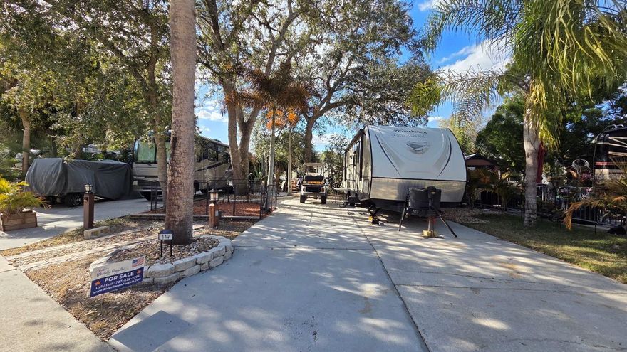 Deeded RV Lot for SALE in Central FL!  Check out this prime Phase 2 Entry-Level Lot at River Ranch RV Resort!  
Discover the perfect home base for your Florida adventures at the renowned River Ranch RV Resort. This desirable Phase 2 lot (149 Horseshoe Bend Rd) is the ideal entry-level opportunity for those seeking luxury and comfort. The property features an oversized, extended concrete patio with multiple designated seating areas, perfect for entertaining or relaxing under the mature shade trees.
Ownership includes access to all exclusive RV Resort amenities, including two heated pools, hot tubs, pickleball/tennis courts, and clubhouses. Additionally, enjoy full access to Westgate River Ranch Resort & Rodeo amenities: the Saturday Night Rodeo, Saloon, petting zoo, marina, and adventure park. HOA dues are consistent with other resort lots and cover water, sewer, cable, trash, and 24/7 gated security. Don’t miss this chance to own a piece of Central Florida’s premier cowboy-themed luxury destination!