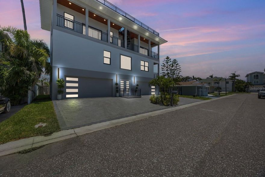 One or more photo(s) has been virtually staged. Live the Ultimate Coastal Lifestyle in Surfside at Redington Shores!
Just steps from the beach, this stunning new construction 3-bedroom, 3.5-bath home in the sought-after Surfside Subdivision offers luxurious finishes, spacious living, and unmatched views of the Gulf and Intercoastal.
From the moment you arrive, you’ll appreciate the thoughtful design of this elevated beachside retreat. The first level features dual 2-car garages and a welcoming foyer that leads upstairs to expansive living areas designed for a relaxed Florida lifestyle.
On the second level, soaring ceilings, large picture windows, and high-end light fixtures create a bright and elegant space. The heart of the home is the gourmet kitchen, boasting quartz countertops, soft-close cabinetry, stainless steel appliances, double oven, cooktop, and a large breakfast bar with seating for four, perfect for hosting friends or casual mornings.
On the second level you'll also find a spacious guest bedroom with its own private ensuite, offering comfort and privacy for family or visitors. The open-concept living area flows seamlessly to a generous outdoor patio through sliding glass doors, while an exposed staircase and dramatic chandelier draw you up to the third floor, where coastal luxury continues.
Upstairs, you’ll find two additional bedrooms, each with private ensuites, walk-in closets, and sliding glass doors leading to an oversized west-facing patio, the ideal spot to unwind with sweeping sunset views over the Gulf. A separate entrance to the patio makes it perfect for guests or entertaining.
A true highlight of this home is the rooftop terrace, accessible via a charming winding staircase. With 1,275 square feet of open-air space and panoramic water views, it offers endless opportunities for lounging, dining, or hosting unforgettable gatherings under the stars. Additional features; Built in 2024 with premium finishes throughout and the Builder is still available for potential customizations. Added storm protection with flow through vents on the first floor, all living spaces elevated, hurricane impact rated windows and doors. Indoor laundry closet, tankless water heater, Trane dual-unit HVAC system, and so much more. Located just a 5-minute walk to Redington Beach access, Surfside residents enjoy proximity to local dining, charming shops, and the Suncoast Trolley, connecting you from St. Pete Beach to Clearwater Beach. Optional membership to Surfside Beach Club includes access to a private beach, exclusive parking, and prime coastal lounging areas. Your dream beach home is here. Luxury, location, and lifestyle in perfect harmony. Schedule your private showing today!