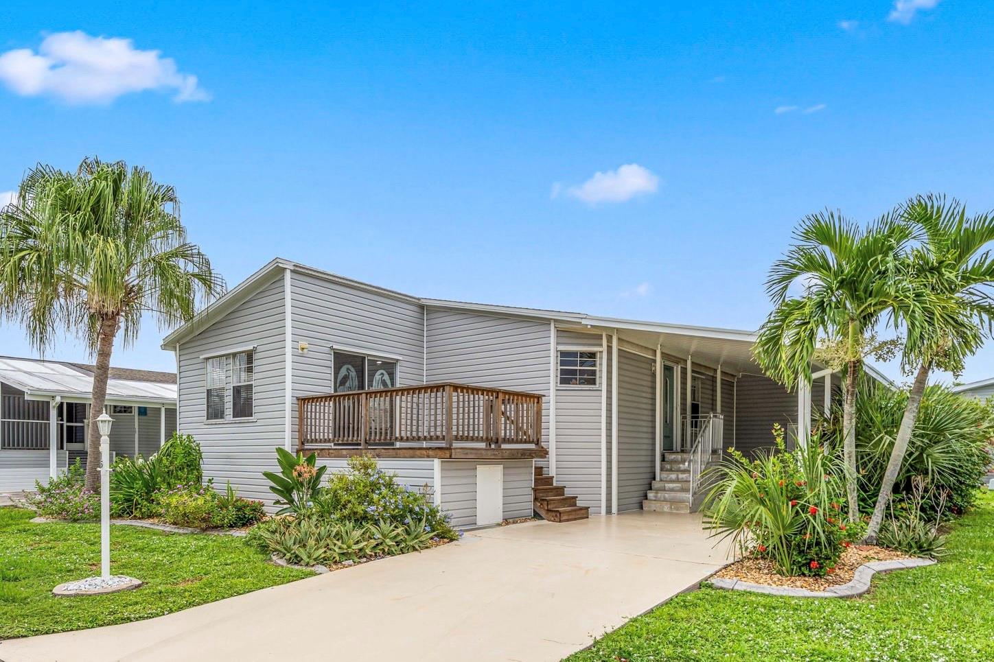Come enjoy the relaxed Southwest Florida lifestyle in this beautifully remodeled home in the sought after Windmill Village 55+ community - with direct gulf access marina! The home's remodel was recently finished and includes a NEW SHINGLE ROOF, NEW vinyl siding, NEW AC, NEW shaker style kitchen cabinets, NEW large center island & breakfast bar, all NEW granite counters and farmhouse style sink, NEW luxury vinyl flooring, two NEW bathrooms with walk in showers and so much more! Easy to keep and perfect for entertaining year round. The home also offers a deck with storage under, a storage/workshop and plenty of carport and driveway parking. This very active community is lovingly maintained and the pride of ownership shows! Every month a full events calendar and newsletter offers all sorts of activities on-site and off! All this topped off with a gated entrance, easy access to I-75 and lots of shops while still being quietly tucked away in a truly perfect setting. Resident owned community - there is an $18k buy-in park share / bond in addition to the purchase price. The 'Buy-in / Park shares' is refunded to seller upon sales/transfer.
