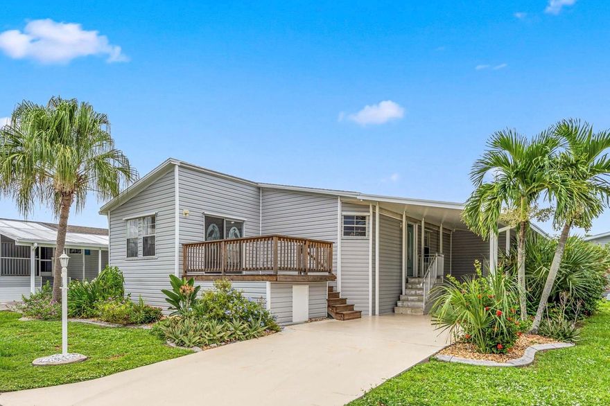 Come enjoy the relaxed Southwest Florida lifestyle in this beautifully remodeled home in the sought after Windmill Village 55+ community - with direct gulf access marina! The home's remodel was recently finished and includes a NEW SHINGLE ROOF, NEW vinyl siding, NEW AC, NEW shaker style kitchen cabinets, NEW large center island & breakfast bar, all NEW granite counters and farmhouse style sink, NEW luxury vinyl flooring, two NEW bathrooms with walk in showers and so much more! Easy to keep and perfect for entertaining year round. The home also offers a deck with storage under, a storage/workshop and plenty of carport and driveway parking. This very active community is lovingly maintained and the pride of ownership shows! Every month a full events calendar and newsletter offers all sorts of activities on-site and off! All this topped off with a gated entrance, easy access to I-75 and lots of shops while still being quietly tucked away in a truly perfect setting. Resident owned community - there is an $18k buy-in park share / bond in addition to the purchase price. The 'Buy-in / Park shares' is refunded to seller upon sales/transfer.