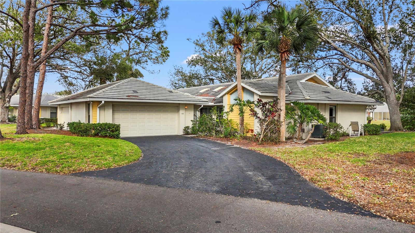 Welcome to your own slice of Florida paradise where stunning water views and effortless living come together in the highly sought-after community of Myrtle Trace at The Plantation. This vibrant three-bedroom, two-bath villa is more than just a home—it’s a lifestyle. Wake up to peaceful lakefront scenery and sip your morning coffee on the lanai as herons and egrets glide by.
The sun-drenched Florida room with floor-to-ceiling glass sliders blends indoor and outdoor living beautifully, while vaulted ceilings and skylights flood the home with warmth and natural light. The updated kitchen features wood cabinetry, solid surface counters, and stainless steel appliances—ready for your favorite culinary creations.
The spacious owner’s suite is a true retreat with dual vanities, a walk-in shower, and tranquil water views. The sparkling master bath features elegant crystal chandeliers that add a touch of luxury to your everyday routine.
A rare gem in the community, the third bedroom was once a patio or terrace—now transformed into a full bedroom, ideal for guests, a home office, or cozy hideaway. Just outside, a separate patio space offers the perfect spot to soak in the Florida sunshine or enjoy a cool shandy beneath the shade of the oaks.
Myrtle Trace is lined with majestic oak trees and charming brick roundabouts that give it a picture-perfect, tucked-away feel. The community offers a heated pool, a welcoming clubhouse, and year-round social events where neighbors truly become friends.
And when you’re ready to explore, you’re minutes from charming downtown Venice, beautiful Gulf beaches, shopping, dining, and the new Wellen Park entertainment district. The Plantation Golf & Country Club is just around the corner for world-class golf and amenities.
Whether you're relaxing poolside, catching sunsets on the lanai, or exploring everything the area has to offer, this home is the perfect place to make lasting memories. Don't miss out—schedule your showing today.