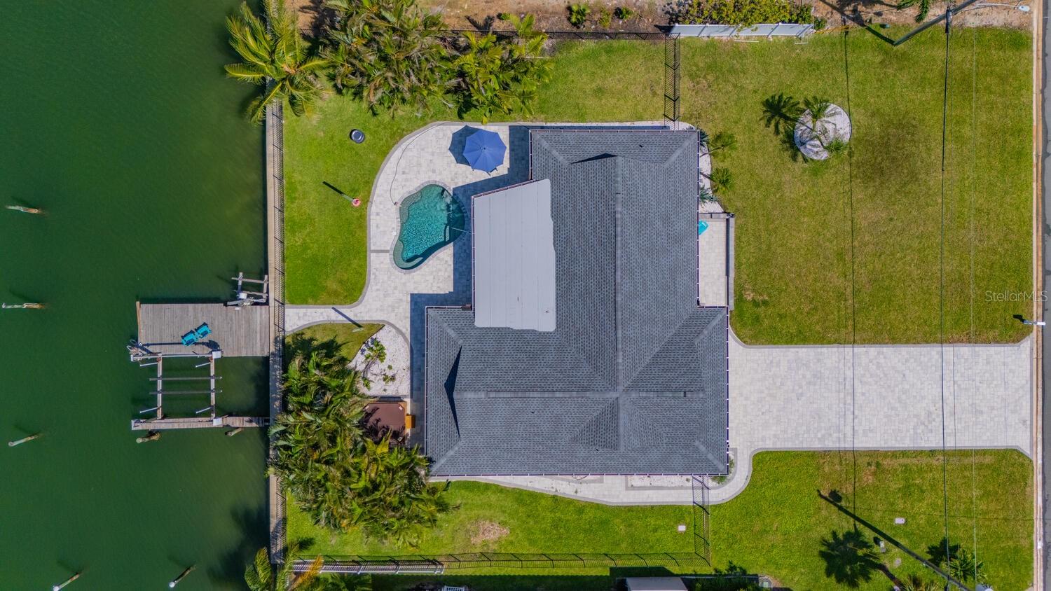 Exceptional Waterfront Lot - 105' on Isle of Capri | Treasure Island, FL - An extraordinary opportunity to build your dream home on one of the most desirable lots in Treasure Island's sought after Isle of Capri. This oversized west-facing parcel measures 105’ x 120’ and offers 105 feet of deep-water frontage with stunning water views and direct Gulf access via John’s Pass. Enjoy nightly sunsets from your future backyard oasis, perfectly positioned to take in the glow of golden hour over the water. Boating is effortless with a private dock that includes a heavy-duty boat lift, jet ski lift, and a slip for larger vessels. The lot is provided with modern conveniences including a reclaimed water irrigation system and is surrounded by upscale homes, including a newly listed $11M property just a few doors down, making this location a true standout. This is a rare chance to secure prime waterfront real estate in one of the most sought-after neighborhoods on the Gulf Coast. Whether you're ready to build now or invest in the future, this property offers the ultimate in space, views, and location. Schedule your private tour today and start planning your coastal escape.