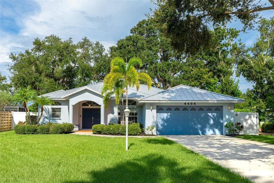 Welcome to 4454 Hollybrook Way in Greenfield, one of Sarasota’s most desirable and well-kept communities surrounded by beautiful landscaping, tropical settings, ponds, and natural preserves. This beautifully updated 3-bedroom, 2.5-bath plus Den residence offers 2,180 sq. ft. of living space with a highly functional split floor plan.

The spacious primary suite is a true retreat with dual walk-in closets, an oversized ensuite bath featuring dual sinks, a soaking tub, and a separate shower, plus private access to the screened lanai. Two additional bedrooms share a full bath on the opposite side of the home, providing comfort and privacy for family or guests.

The heart of the home is the open kitchen with a breakfast bar, island, and pantry overlooking the family room, creating an ideal space for both everyday living and entertaining. A formal living room and dining area add flexibility for gatherings and special occasions.

Notable updates include a new HVAC system (2023/2024), new luxury vinyl plank flooring (2023), and a new pool and spa (2022). The kitchen appliances have also been refreshed with a new refrigerator (2022) along with a washer and dryer (2021). Additional improvements include new carpeting in 2021, a new Electric Panel (2021), Metal Roof (2018), and fresh exterior paint completed in 2019. These thoughtful updates provide peace of mind and modern convenience for the next owner.

The covered and screened lanai with the newly added pool and spa offers a private outdoor oasis perfect for relaxing or entertaining, all set against the backdrop of lush tropical landscaping. Greenfield residents enjoy low HOA fees, no CDD, and an excellent location near A-rated schools, Urfer Family Park, downtown Sarasota, University Town Center, and only 8 miles to world-famous Siesta Key Beach. Best of all, this home is located outside the flood zone. Don’t miss the opportunity to own this stunning residence in one of Sarasota’s hidden gems! Be sure to experience the 3D Matterport Interactive Walkthrough and schedule your private viewing today!