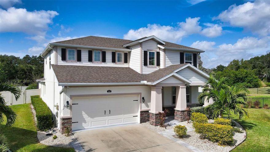 This is the one! This maintenance-free, spacious, and bright home on a Cul-da-sac was built in 2017 and had an elaborate pool with a waterfall, a large privacy fence, and a fire pit added in 2018. In addition to these wonderful features, this residence has a brand new A/C in 2023, a pool sundeck with fountains to lounge and relax in, a built-in custom wine cabinet refrigerator with a built-in glass partition at the top as a unique cork display feature, water misters on the pool deck, central vacuum, 5.1 surround sound in the living room, Nest thermostat, whole house water purification system as well as a home security system complemented with a ring doorbell, Tesla EV charging station in the garage, remote 3 sided faux fireplace with storage in the living room, new laminate floors upstairs and in the master bedroom, outdoor plumbing available on the pool deck and too much more to list! This beautiful home that has been meticulously maintained needs nothing. No expense was spared in this home! With the master bedroom on the first floor that looks out into the waterfall and a colored in-ground pool oasis, this home is ideal for any family configuration. Four total bedrooms include an upstairs master en suite with two bonus areas to ensure everyone in the house has their own private space and day activities could include a dip in the new pool, a corn hole tournament in the fenced-in yard, or a meal under cover on the patio. Night time could be spent toasting marshmallows at the fire pit or sitting on the porch swing greeting neighbors on their evening strolls. This home in a family-friendly neighborhood is not one to be missed. Smart Home lovers will enjoy smart bulbs, remote-controlled devices, and even smart fridges which makes this a futuristic connected home. Call today, to schedule your private tour! Click the link for a Virtual Tour! https://pix360.com/vtour/35703/