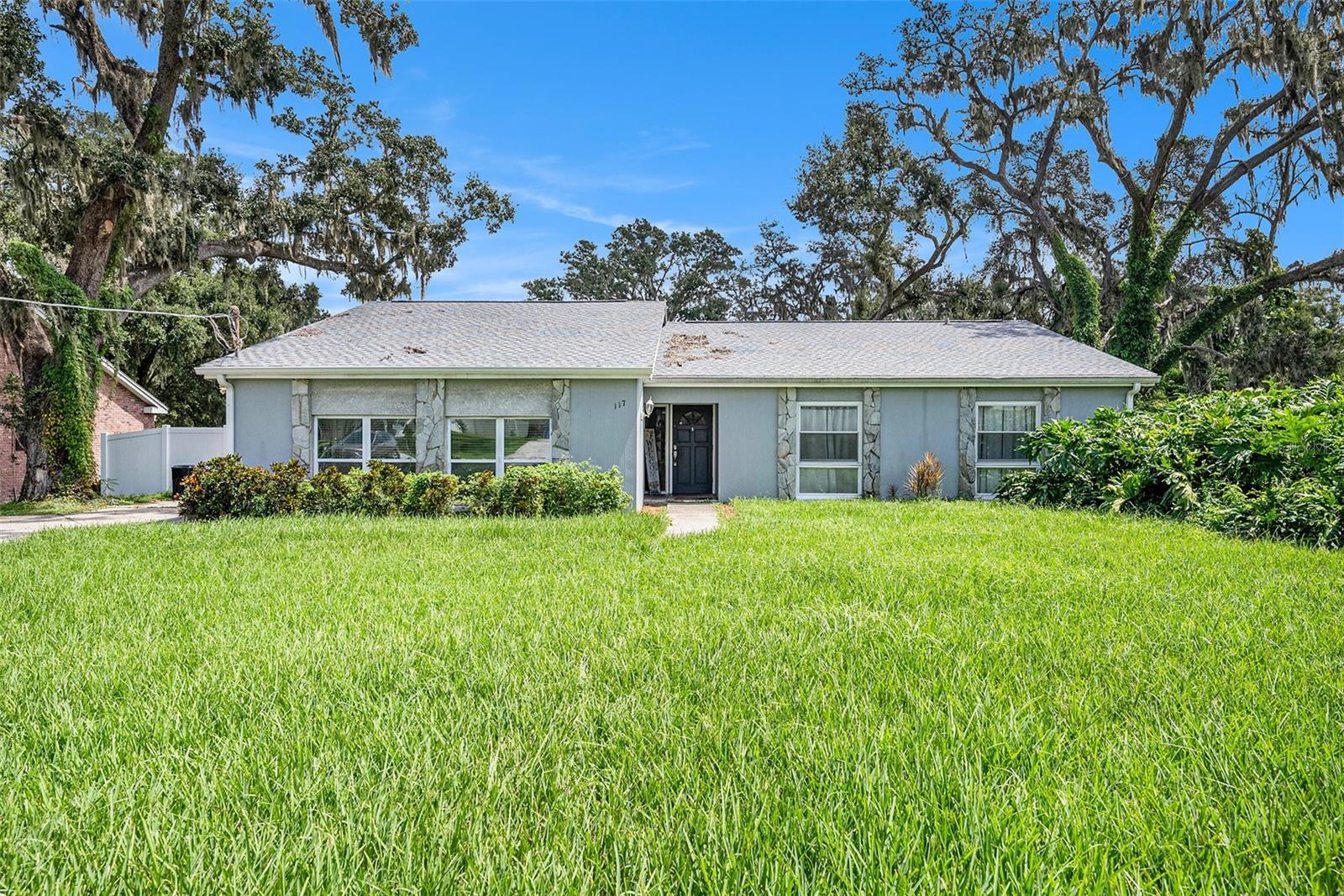 ASSUMABLE 3.01% FHA LOAN! Peace of mind with new roof (2023), HVAC (2022), water heater (2024), appliances (2025), and fencing (2025). Features include cathedral ceilings, laminate floors, cozy fireplace, and an oversized rec/game room. Kitchen with snack bar and pantry overlooks the backyard. Main suite offers French doors to the screened lanai, walk-in closet, and ensuite bath. Nearly ½ acre fenced yard with room for garden, boat, or RV. Prime location near I-4/I-75, minutes to Brandon Mall, Topgolf, Busch Gardens, Mango Dog Park, dining, and shopping. The perfect mix of updates, space, and convenience!