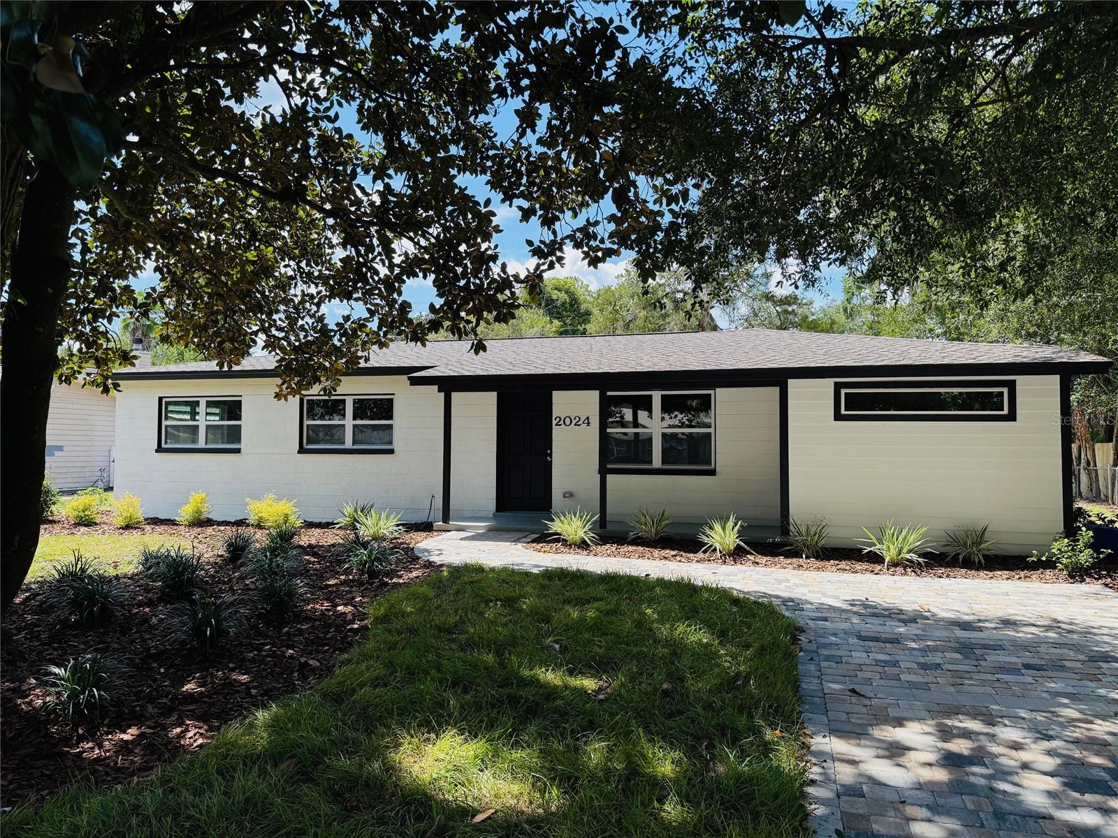 Completely remodeled 4 bed, 3 bath home offering maintenance-free living and the feel of a brand-new house! This solid concrete block home features a modern granite kitchen with stainless steel appliances, stylish finishes throughout, and spacious living areas perfect for families or entertaining. With updates top to bottom, you can move in worry-free. Enjoy the upcoming cold-weather months by the cozy backyard fire pit, ideal for gatherings or quiet evenings. Don't miss this rare blend of quality, comfort, and convenience!