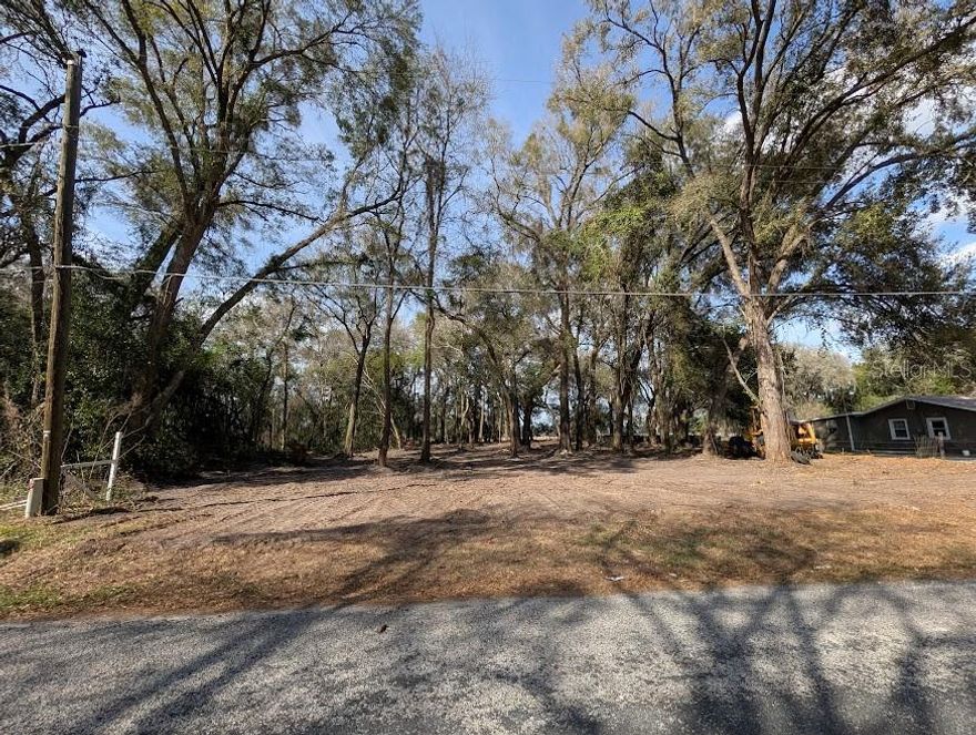 One half acre close to town, zoned for a house, no mobiles, no HOA, no restrictions, level, under brush has been cleared out.  Build your house and have your toys with no restrictions.  Ok for a barn or detached garage.  Backs up to a farm.  Mobile homes at the end of the dead end street.