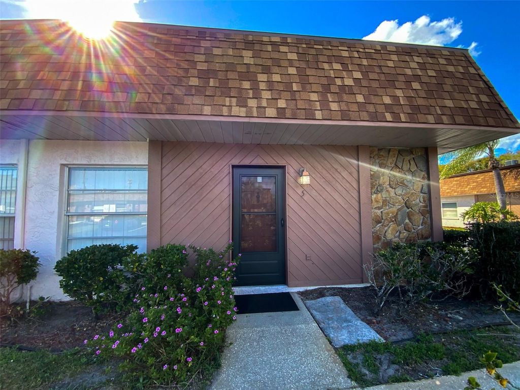 Photo of 6036 Chesham Drive #5, New Port Richey, FL 34653 (MLS # TB8484100)