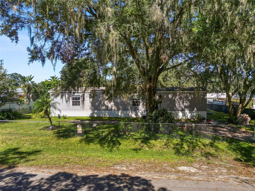 Take a look at this 2 bedroom 2 bathroom home located on a fenced in lot with NO HOA! This home features an open floor plan and split bedrooms. The living area features laminate flooring and plenty of natural light. The kitchen is spacious with plenty of cabinet and counter top space and a large pantry/laundry room. The primary bedroom offers plenty of space and features an en suite with a single sink vanity, tub/shower combo and walk in closet. You’ll find the second bedroom on the opposite side of the home with carpeted flooring and a walk in closet. The main hall bathroom features a single sink vanity and a tub/shower combo. The 3 TV's (2-55",1-65") will also remain with the home. Outside you’ll find a block outbuilding with the well pump. This home has so much to offer! Schedule your private showing today!