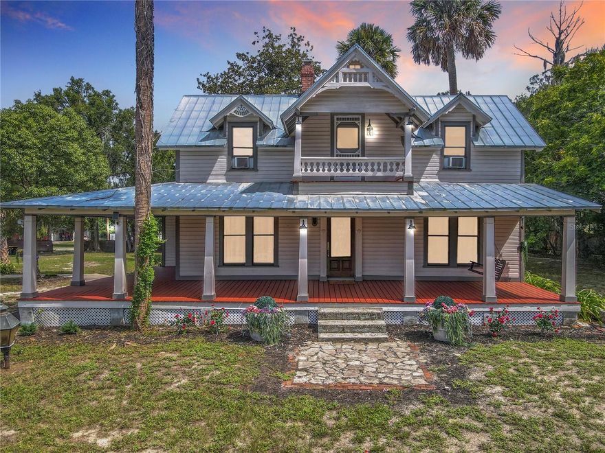 Step Into History And Discover The Timeless Beauty Of This Charming 1886 Victorian Home, A True Landmark Right Here In Orange City. Nestled On 1.76 Acres Of Peaceful, Park-Like Land, This Property Welcomes You With A Majestic Palm-Lined Driveway That Once Guided Horse-Drawn Carriages To The Front Porch. The Grand Wraparound Porch, Multiple Screened Porches, And Second-Floor Balcony Create Endless Opportunities To Relax, Host Gatherings, Or Simply Enjoy The Gentle Breeze And Shaded Outdoor Living Spaces.  Inside, Every Room Reflects Warmth And Historic Character, From The Handcrafted Woodwork To The Many Fireplaces Found Throughout. Large Windows Invite Natural Light Into The Living Room And Dining Room, Both Of Which Feature Beautiful Fireplace Details And Built-Ins.
The Updated Kitchen, Located Just Off The Dining Room, Offers Stainless Steel Appliances, A 6x6 Walk-In Pantry, And Easy Access To The Back Screened Porch And Charming Garden Area.  The Main Level Also Includes A Bright, Spacious Room With A Fireplace That The Previous Owners Used As A Primary Suite, But It Would Also Make A Wonderful Sitting Room, Office, Library, Or Guest Space.
Use The Beautiful Wooden Staircase At The Front Of The Home To Reach The Second Floor, Where You’ll Find The True Primary Suite Featuring A Large 6x16 Walk-In Closet, A Soaking Tub, And Peaceful Views Of The Grounds. Across The Hall Sits Another Bedroom.
One Very Unique Feature Of This Property Is The Private Back Entrance, Located Off The Kitchen And Screened Porch, Providing Direct Access To The Third Bedroom Upstairs Without Going Through The Main Living Areas. This Is Perfect For Someone Who Works From Home, Needs A Private Studio Or Office, Or Wants A Comfortable Guest Space With Extra Privacy. Outside, You’ll Find A Detached Two-Car Garage Complete With An Electric Vehicle Charging Station, Along With Ample Areas For Gardening, Pets, Play, Or Simply Enjoying The Quiet Surroundings. The Property Feels Tucked Away Yet Remains Convenient To Everything — Shopping, Restaurants, Medical Facilities, And More. Blue Spring State Park Is Only Minutes Away, Along With Downtown Deland, New Smyrna Beach, Downtown Orlando, And I-4.
Now Being Offered At $500,000, This Is A Rare Opportunity To Own A Beautiful Piece Of Orange City’s History With All The Charm, Space, And Timeless Appeal You’ve Been Looking For.