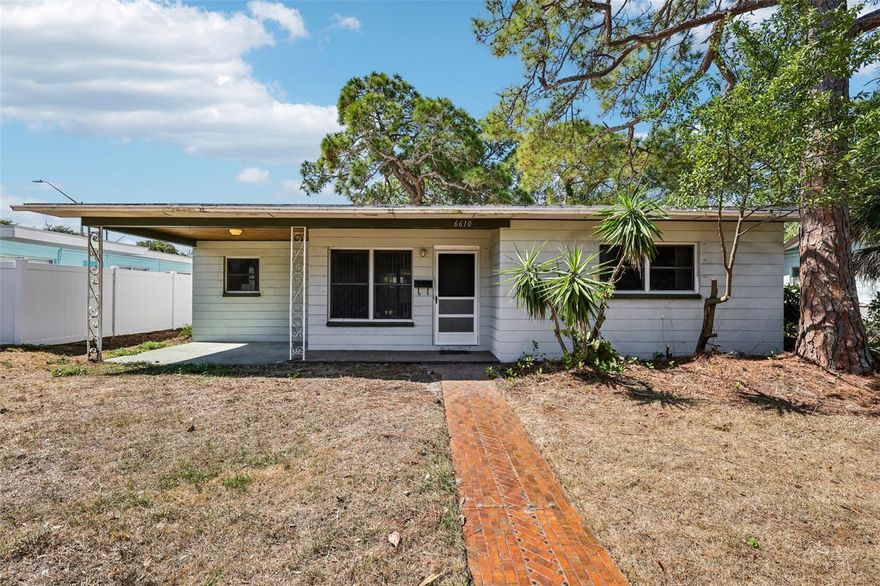 Investor and renovation-buyer opportunity in St. Petersburg's established Lake Pasadena neighborhood. This 1955 concrete-block single-family home sits on a generous 8,002 sq ft lot (63 x 127) and offers 1,248 sq ft of living space with classic mid-century bones ready for your vision. Solid concrete-block construction, 2 bedrooms and 1.5 baths in a single-story layout, central heat and air, a covered carport (260 sq ft), open porch (180 sq ft), and a detached storage shed. Flood Zone X means minimal flood risk and lower insurance carrying costs. Bring your design ideas and turn this property into something special. Whether you are an investor adding to your portfolio, a flipper hunting for the right canvas, or a buyer ready to put your stamp on a home with great bones in a sought-after location, this one delivers the fundamentals. Just minutes from Pasadena Ave dining and shopping, Tyrone Square Mall, downtown St. Pete, and the Gulf beaches. Sold strictly AS-IS. All measurements are approximate; buyer to verify all information. Schedule your showing today.