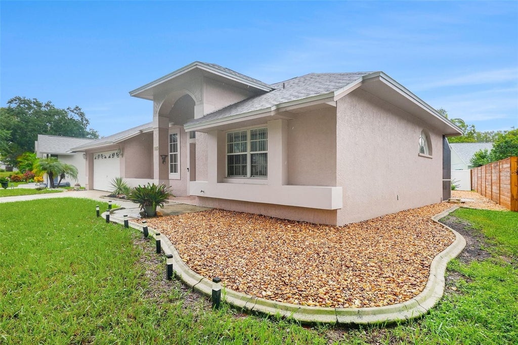 Photo of 907 Brittany Park Boulevard, Tarpon Springs, FL 34689 (MLS # O6448925)