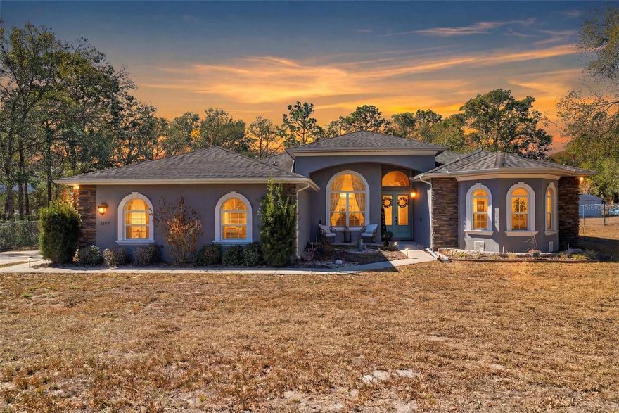 Experience exceptional living in this spacious Inverness home, designed for comfort, productivity and entertaining. Set on a fenced quiet 1/2 acre parcel this home gives you the perfect balance of sophistication and serenity. From the moment you arrive, you will appreciate the home's architectual presence and inviting entry. High ceilings, crown molding, large windows offering loads of natural light with an open concept plan creating an atmosphere ideal for both work from home lifestyle and refined relaxation. The oversized primary bedroom suite features a flexible sitting area, perfect for working from home, creating a nursery or enjoying a personal fitness space, plus spacious dual walk in closets and a large spa like bath with a jetted tub, dual sinks and walk in shower. The kitchen island boasts an additional sink for prep as well wooden cabinetry and solid surface counters. Large family/recreation room showcases more built in shelving and is open to the kitchen and informal dining area. Tile and luxury vinyl plank flooring are throughout the home. Spend the afternoon and evening enjoying your deck, BBQ, jump in the pool all in the privacy of your spacious backyard. Hurricane shutters and a whole house generator too! Don't delay call today.