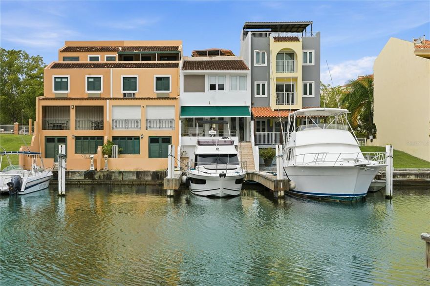 Rare marina-front turnkey home in the double-gated Plaza Mayor community of Palmas Del Mar, featuring a private deeded 50’ boat slip and newly built dock, steps from your back door.

This fully renovated 3-bedroom, 2½-bath home offers 1,615 heated sq ft with vaulted ceilings, a living room skylight, and expansive windows framing the marina. The open-concept layout showcases luxury craftsmanship, modern coastal finishes, and a newly installed driveway, combining seamless indoor-outdoor waterfront living.

Located within a private community, enjoy walking access to 14 restaurants, beaches, golf, tennis, pickleball, gym facilities, spa amenities, and an equestrian center. A rare opportunity to own marina-front living with a deeded 50’ slip in one of Puerto Rico’s premier resort communities — a true yacht lover’s dream.

A 35’ 2021 Jeanneau yacht with flybridge and 3 cabins is currently available for purchase, providing direct access to Vieques, Culebra, Virgin Islands, and the open Caribbean waters.