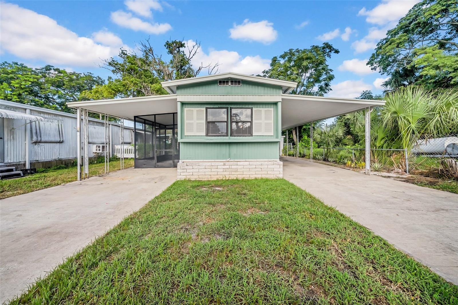 Stunning 2-bedroom remodeled home that will absolutely delight you the moment you walk in the door! Brand new gorgeous laminate flooring, walls that have been replaced with sheetrock and freshly painted and wait until you see the open concept kitchen and living room that will delight you and your family! Newer appliances recently installed to include an amazing gas stove, fridge and microwave that are stainless steel! You can sit and relax in this spacious area enjoying the breeze of the pristine ceiling fans while watching the chefs cook their masterpiece, no one will miss a thing! The bathroom was also updated and is equipped with grab bars and you will be happy to see the 2018 hot water heater big enough for you and the gang! You will also rest easy knowing this home is equipped with a brand-new Mini split so this home can easily stay cool. As if all this is not enough, wait until you step outside into the beautiful porch that looks out at newly planted Floridian trees that will soon give that real Tropical feel to the new owners as this lush landscaping grows and embraces you! The exterior of this home has also been being freshly painted and to top it all off, a brand-new power pole has been put up outside so you know this owner did everything to turn this abode into your turnkey dream paradise! Even the lanai has been rescreened and so much more! Let's not forget the fenced in yard which means your fur babies can enjoy it too and there is also a large storage shed with washer and dryer hook ups! This property boasts 2 carports and 2 driveways so plenty of room for parking! This subdivision is centrally located to everything being only a few minutes' drive to medical, shopping, restaurants, hospitals and the famous Sun West beach/aquatic Park! Tampa international and Clearwater beach less than an hour's drive!! At this price point you had best plan to come quickly to check it out before its gone! Come and see for yourself, no HOA here so you can enjoy this home your way! You will be glad you came as so much time, effort and craftsmanship has gone into making this home an absolute oasis just waiting for the right person to come and love it back!!