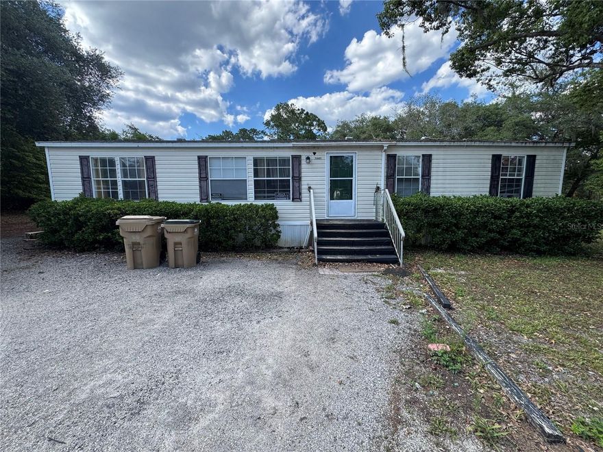 This property offers a great opportunity to enjoy peaceful country living with room to make it your own! This semi-updated mobile home features recent improvements while still leaving potential for additional cosmetic updates and personal touches. The spacious lot provides plenty of room for boats, RVs, work equipment, animals, gardening, or future expansion. Enjoy the privacy and flexibility of rural living while still being conveniently located near Eustis, Mount Dora, shopping, dining, and major roadways. Whether you’re looking for a primary residence, investment opportunity, or a property with land and potential, this one is worth a look!