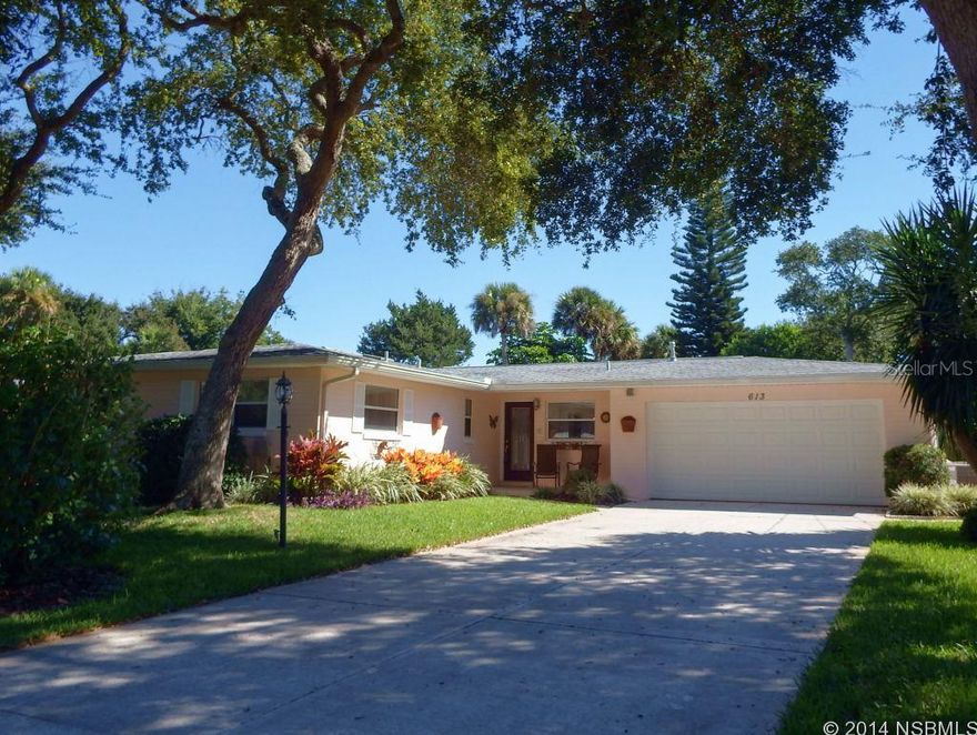 ENJOY THE FLORIDA LIFESTYLE in this Meticulously Maintained 3 BD/3 BA CB home. Totally remodeled in 2006, this BEACHSIDE HOME HAS IT ALL!  The moment you step inside the front door you'll be amazed at all the features this home has to offer.  20" diagonal tile floors lead into a SPACIOUS Dining Room and HUGE Living Room with two sets of wind rated, tinted triple sliding doors opening up to the pool area. The kitchen was custom designed with 2 refrigerators, 5 burner gas range w/warming racks and double gas oven w/convection, solid wood cabinets with embellished custom granite countertops.  In the Master Bedroom, enjoy a great view of the pool from the triple sliding glass doors.  Master Bedroom Walk-in Closet is also a Safe Room with 12 " reinforced concrete walls, steel door and security system.  Large Master En Suite Bath has double sinks and vanities, extra large walk-in shower with double shower heads and a walk-out atrium. Ceiling fans throughout. Security system with security cameras that can be monitored on your TV; infrared beams on sliding doors going out to pool for child security.   Entertain friends & family around the Screened Salt Water Pool which features ColorLogic LED pool lights, fountains and solar heat.  Pool area includes 376 ft. patio and 260 ft. covered outdoor dining area completely plumbed and wired for your summer kitchen; also wired for hot tub/spa.  Second Master Bedroom has its own full bath w/walk-in shower and large closet. Guest Bath has skylight and frosted French door. Bonus room for office, den or 4th Bedroom. House is hardwired for portable generator.  Surround sound system in main living areas and pool area. Lovely landscaped lot with large shady oak trees; irrigation well and sprinkler system.  Hurricane Shutters. NEW Wind Rated Garage Door. Outdoor Workshop/Shed w/electric can be used for artist studio. NEW Roof, gas water heater, dishwasher in October 2015. ;Water: City