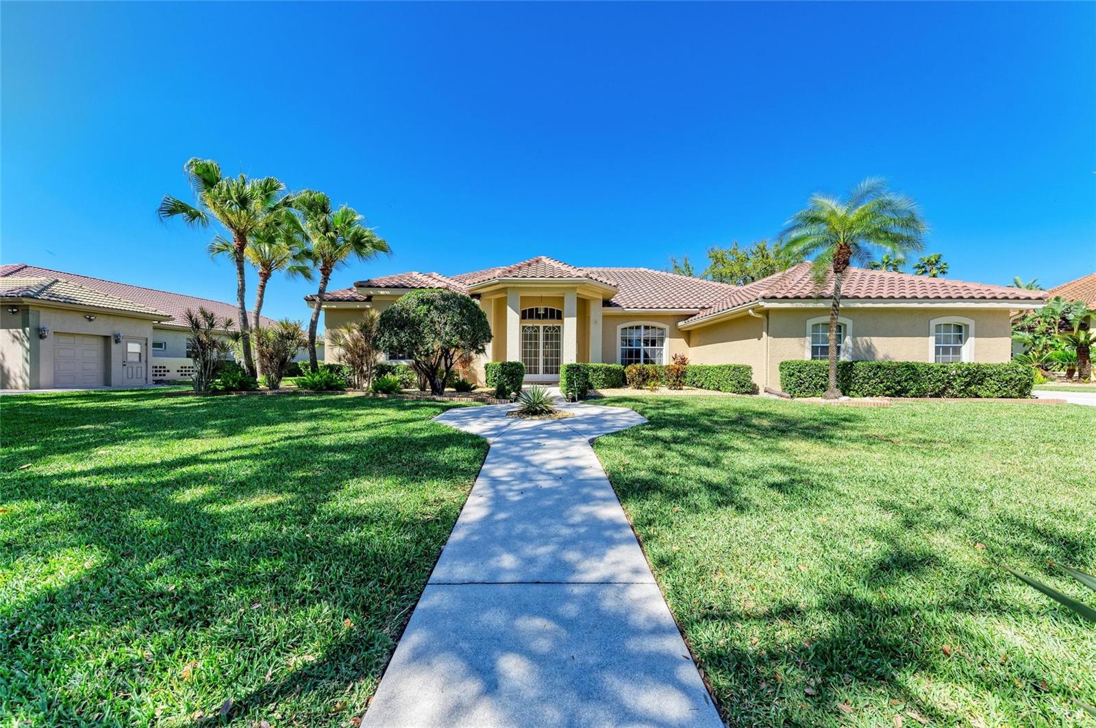 Welcome to this beautifully updated 4-bedroom, 3-bathroom home located in the highly sought-after gated community of Misty Creek in Sarasota. This spacious residence offers refined comfort, thoughtful upgrades, and the best of Florida’s indoor-outdoor lifestyle.
The heart of the home is a stylish kitchen with an island and upgraded finishes, which flows seamlessly into a warm and inviting family room featuring rich wood flooring. Travertine tile extends through the kitchen, laundry room, hallways, and bathrooms, while the bathrooms have been tastefully modernized, and a whole-house water softener system enhances everyday living.
Step outside to your private retreat, complete with a resurfaced heated lap pool, new pool pavers, an oversized open-view lanai, and a fully equipped outdoor kitchen—perfect for entertaining and year-round enjoyment. The lush, freshly sodded lawn, installed with over 2,600 rolls in 2024, adds to the beautifully maintained grounds.
Significant updates include a new tile roof in 2023, one new A/C unit in 2023, two new water heaters installed in 2023 and 2025, fresh exterior paint completed in 2023, and interior paint done in 2023 as well. The property also includes a spacious three-car garage, low HOA fees, and no CDD. Golf enthusiasts will appreciate that a membership is available but not mandatory. A home warranty is also being offered, providing added peace of mind.This exceptional property combines modern comfort, quality upgrades, and serene surroundings in one of Sarasota’s premier gated communities.
