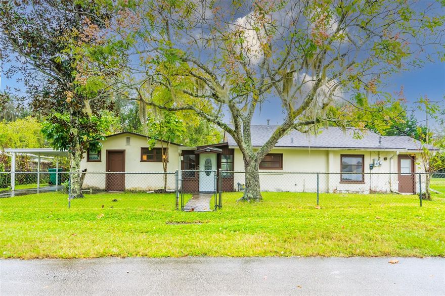Centrally located New Smyrna Beach home with great potential. Air conditioner was replaced in September 2019 and the roof was replaced in 2010. Natural gas appliances. This home features a unique floor plan with 2 bedrooms and 1 bath attached by an enclosed breezeway to 1 bedroom, 1 bath, and a carport. Situated on a corner lot, the property is completely fenced in. Needs some TLC but has great potential. Five minutes to the beach, less than one mile to Publix, walking distance to restaurants and shopping. ;Water: City