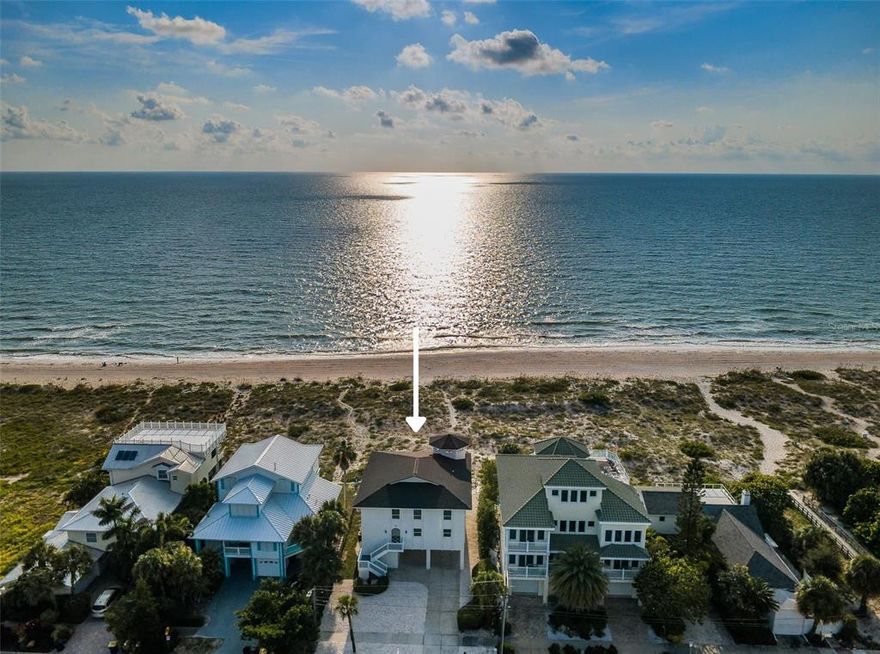 Indulge yourself in the opulent lifestyle you have always dreamed, where the sand is white like powered sugar, inviting turquoise waters and spectacular sunsets. This charming Gulf front home is a rare jewel nestled among a beautifully landscaped oasis, steps away from the white sandy beaches with wide open views of the Gulf of Mexico. Four bedrooms, three & half bath home with its double balconies has endless possibilities. This property is perfect for that special buyer seeking an exceptional opportunity to develop or to restore this Gulf front gem. A unique residence that is an oasis of serenity on the market for the first time in 27 years. The elevator services 3 levels and is adjacent to the car park. 1st floor storage for your beach toys, paddleboards, kayaks & fishing gear. Outdoor shower. Light and bright windows galore 2nd floor dining & great room have French doors that open onto the covered balcony. The spiral staircase provides access to the beach and Gulf of Mexico. Enjoy entertaining at the mirrored built-in wet bar. Chef's delight kitchen granite top center island with cook top, wall oven & dinette overlooking the Gulf. Interior laundry. The guest bedroom has bathroom en-suite. The 3rd floor bonus room is a delightful retreat for any family. Gulf front sumptuous master bedroom retreat, walk-in closet - French door access to covered balcony overlooking the Gulf of Mexico. Additional carpeted bedroom has bath en-suite. The fourth bedroom has a spiral staircase that leads to the widow's watch perfect for practicing yoga & watching sunsets. Roof 2022. Availability to park at least 6 cars and a golf cart on the drive. Walk, bicycle or golf cart to the Clearwater Beach community recreation center, pool, tennis court, boat ramp, marina, restaurants & shops. Carlouel Beach & Yacht Club founded in 1934 is one of the finest private, member owned clubs in Florida and was conceived, designed and organized to provide members the best in club facilities and services. Contact Carlouel directly regarding membership possibilities.