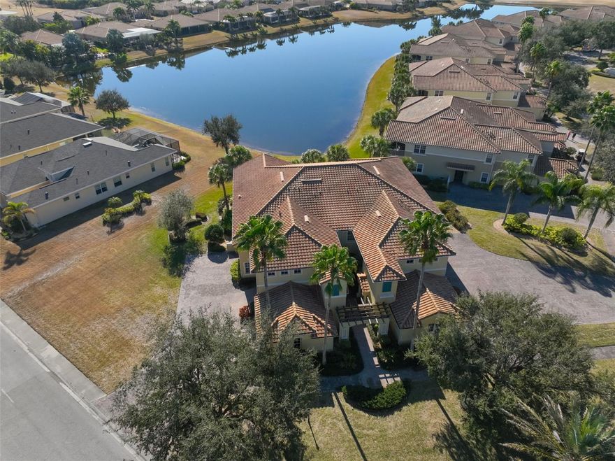 *CLICK ON INTERACTIVE 3d TOUR* MOTIVATED SELLER - WATERFRONT VIEW, SECOND FLOOR, MAINTENANCE FREE, luxury condo nestled in highly desirable Toscana community of Renaissance! A piece of paradise offering one of the best WATER VIEWS and located approximately 100’ from the Renaissance Golf and Country Club! OPEN FLOOR PLAN has almost 2500 sq.ft. of living space & is accessed via a WIDE CURVING STAIRCASE or YOUR OWN PRIVATE ELEVATOR that is maintained by the association. WATER view from the covered, screened & PRIVATE lanai are immediate once you enter the great room. Open floor plan makes it IDEAL for entertaining. KITCHEN boasts of ALL CHERRY WOOD cabinetry, GRANITE countertops with a soft modern pattern & a backsplash made of STONE compliment the space, along with a large walk-in food pantry. The island offers a LARGE SURFACE counter with seating for six, perfect for family gatherings. STAINLESS STEEL APPLIANCES incl. GAS RANGE are all part of the beautiful upgrades. The great room has a spectacular water view (due to the unique angle of the building), which accommodates both an intimate dining area & breakfast area for those informal meals. The owner’s suite has large windows and sliding doors which give access to the lanai with magnificent views of the water & tropical landscaping! EN-SUITE bathroom has a WALK-IN shower with glass privacy panels and the vanity has dual sinks, granite counters and CHERRY cabinetry. Newer light fixtures and hardware complete the design while adding functionality. The WALK-IN CLOSET is spacious and has lots of shelving. The split plan offers ULITMATE PRIVACY with secondary bedrooms that boast natural light & generous closet space. Guest bathroom will impress with CHERRY wood cabinetry and a GRANITE countertop. The OFFICE/DEN has large windows so that NATURAL SUNSHINE can filter into the room. Laundry room offers shelving and cabinetry. Additional features/updates include tray ceilings, 8’ doors & arched entries, custom light fixtures throughout and natural gas! Renaissance Country Club has an expansive golf shop, restaurant, pool, fitness including an indoor walk/jogging track & a full-service day spa/wellness center. You have access to Sun City Center amenities that has over 100 clubs & organizations to choose from. There are activities to suit virtually every interest! Amenities include community pools (indoor & outdoor), fitness, shuffleboard, softball, lawn bowling, pickleball, lapidary, art & more! Golf carts are a primary source of transportation including grocery shopping, salons, banks, a hospital/doctors, shopping & restaurants! Located close to beaches, 35 minutes to Tampa International Airport & close to Sarasota shops. NOTE: All measurements considered accurate but must be verified by buyer. Roof, Exterior Building, Exterior Water & Landscaping all maintained by the Condo Association. This condo has been kept PET FREE AND SMOKE FREE. VOTED #1 Retirement Community in the USA by Realtor.com & Travel & Leisure.