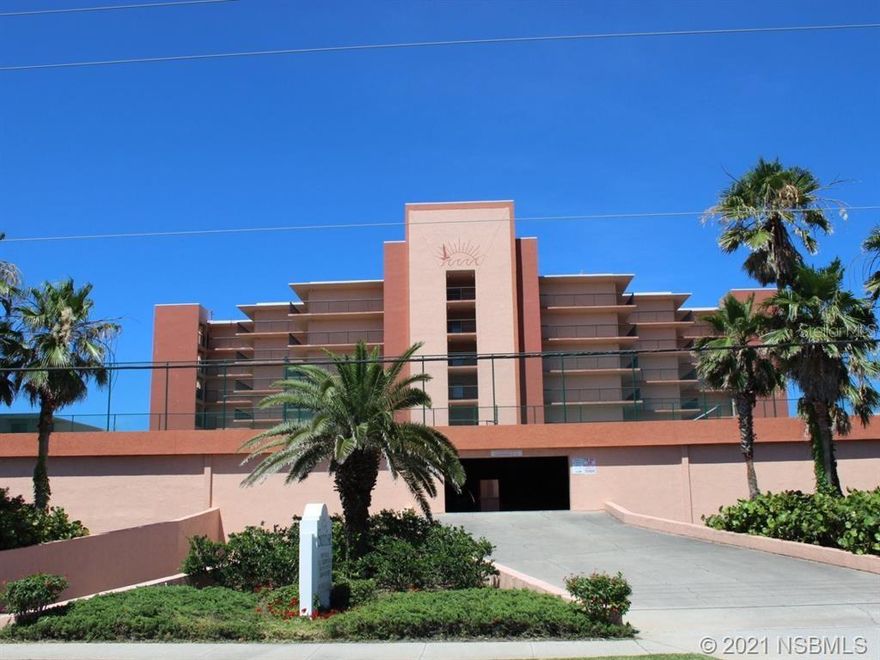 Desirable Ocean Front "no drive beach" ground floor 2 bedroom /2 bath unit in The Sunrise Condominium. Unit has stunning ocean views from almost every room.  Enjoy the sunrises from your two patios. Updated kitchen with granite counter tops and wood cabinets, Stainless steel appliances and breakfast bar. There is porcelain tile throughout unit except in the bedrooms which have distressed wood flooring and an inside laundry unit. New sliders in living room and dining room and new window in living room.  The unit has two levels of covered parking on a first come first serve basis. Enjoy the complex's amenities - pool, tennis & basketball courts, shuffle board and BBQ area. This is a must see unit that is located near to New Smyrna's best dining and shopping and entertainment. ;LocationDescription: Condo ;Water: City