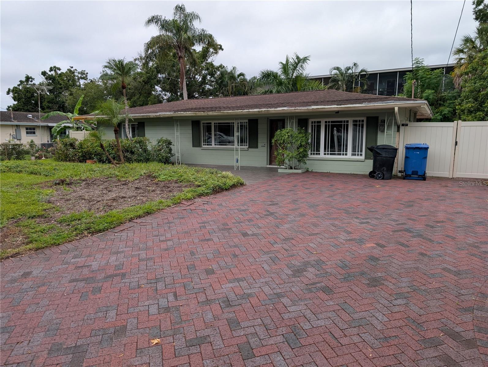 Opportunities like this don’t come around often—and when they’re gone, they’re gone. This well-located 3-bedroom, 2-bath home sits just minutes from one of the most vibrant downtowns in the country, surrounded by top-tier shopping, scenic exercise trails, boat ramps, and multiple parks. Whether you're an investor or a homeowner with vision, this is your chance to unlock serious value.
The property features insulated windows, a paver driveway, extensive walkways, a massive patio, and a covered porch—plus a vinyl fence with double gate access for trailer parking. Recent upgrades include a new flat roof (2024), HVAC (2019), and main roof (2014). Professionally remediated after Helene, the home is ready for your custom renovation. Ask about financing options that make transforming this space easier than you think.