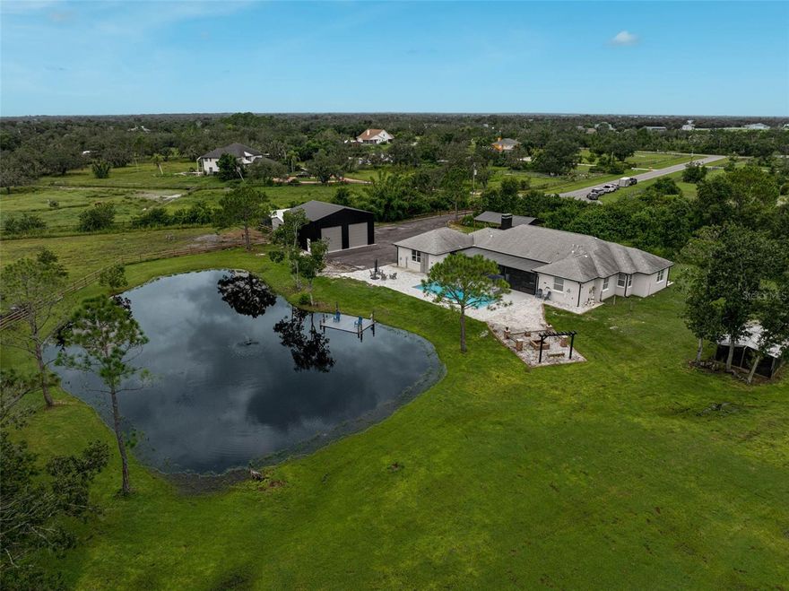 Discover the best of country living with this beautifully updated estate in the Magnolia Hill community of Myakka City. Nestled on 5 acres, this gated property offers both privacy and convenience, located just a short drive from Lakewood Ranch and Sarasota. The 3,100+ sq. ft. home has been extensively renovated since 2019, featuring 5 bedrooms most with walk-in closets, and a spacious bonus room, and an open-concept design ideal for everyday living and entertaining.

The chef’s kitchen showcases dual sinks, wall ovens, an island prep station, a walk-in pantry, and abundant storage. Recent upgrades include a dog wash station in the garage, making the home functional and thoughtfully designed. Outdoor living shines with a sparkling pool, fire pit, and a stocked pond with bass, tilapia, bluegill, and crappie.

Additional highlights include RV electric hookup, metal canopy storage bay for equipment, pole barn for the boat, metal building that could be finished for additional living or entertainment space and ample space to add stables. Magnolia Hill is an equestrian-friendly neighborhood with estate-sized parcels, allowing room for horses, cattle, and more. This property blends modern comfort with classic Florida charm—ready to enjoy today. 

For those needing extra space, the property includes a 32' x 36' metal building with oversized 12' x 12' doors, plus a 20' x 30' boat pole barn standing 11.5' high—perfect for storing boats, toys, vehicles, or outdoor gear.