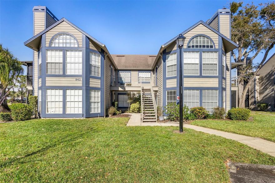 Welcome to easy, LOW-MAINTENANCE LIVING in this beautifully updated FIRST-FLOOR CORNER UNIT located in the park-like Hidden Village community of Lake Mary. This charming, MOVE-IN READY condo features numerous recent upgrades, including wood-look tile flooring throughout, a stylish open kitchen with custom tile countertops, brand-new cabinetry, and added storage ideal for a coffee bar. Both bathrooms have been fully renovated—one showcasing a walk-in shower, new vanity, and tiled walls, while the second bath also offers updated vanities and modern tile finishes.

Filled with NATURAL LIGHT, the home boasts VAULTED CEILINGS and an OPEN-CONCEPT living and dining area that creates a bright, airy feel. The living room is anchored by a cozy FIREPLACE, adding warmth and charm, while French doors lead to a SCREENED-IN LANAI, perfect for relaxing and enjoying the peaceful surroundings bug-free. Additional upgrades include a NEW water heater, dishwasher, and brand-new ceiling fans in every room, offering comfort and peace of mind.

Residents of Hidden Village enjoy mature landscaping, a COMMUNITY POOL, and a tranquil, well-maintained setting, all just minutes from 417, I-4, and Lake Mary Boulevard with easy access to shopping, dining, and everyday conveniences. Stylish, updated, and perfectly positioned, this first-floor condo is a standout opportunity in one of Lake Mary’s most desirable locations. Schedule your private tour today and fall in love with your HOME SWEET HOME!
Seller may consider buyer concessions. Some pictures are virtually staged.