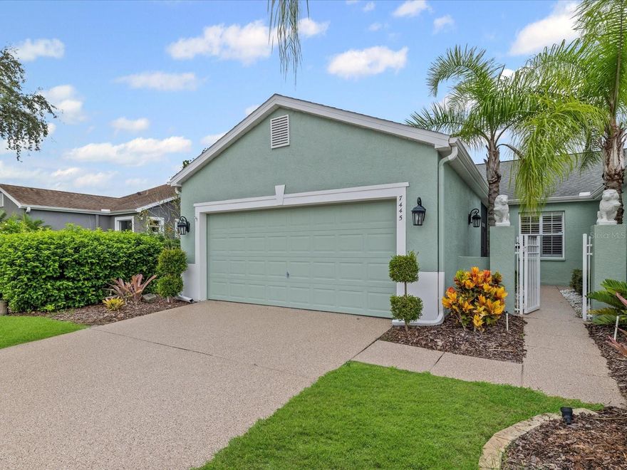 Active Adult Living at Its Finest
Welcome to this inviting 2-bedroom, 2-bathroom home designed for comfort, convenience, and an active lifestyle. A private gated courtyard welcomes you into the property, where a covered and screened front patio with skylight sets the tone for the serene living that awaits.

Inside, the eat-in kitchen features Corian countertops, garage access, a breakfast bar, and plenty of room to gather. The spacious living and dining room combination offers an open feel, while the split-bedroom layout ensures privacy for guests. Both bathrooms are appointed with quartz countertops and matching vanities, and the primary bath includes a linen closet for added storage. A spacious laundry room with cabinetry adds everyday functionality.

Enjoy seamless indoor-outdoor living with triple-stacking sliding glass doors leading to an expansive covered and screened rear patio overlooking a tranquil vegetation view—complete with multiple electrical outlets for entertaining. Durable epoxy-coated driveway, walkway, garage floor, and patios provide easy maintenance, and a tankless water heater ensures hot water on demand. (Some photos have been virtually staged to show potential furniture placement and use.)

Resort-Style Amenities & Worry-Free Maintenance
Set in a vibrant guard-gated active adult community, you’ll enjoy access to:

Pickleball, tennis, and a sparkling swimming pool

Fitness center, hobby clubs, and social activities

Butterfly garden, dog park, boardwalk over the water, and plenty of green space

An active golf course where golf carts are welcome

Sidewalk-lined streets perfect for walks with neighbors or pets

The affordable $300/month HOA covers all exterior lawn care, reclaimed irrigation, exterior pest control, painting, roof replacement, and a robust cable, streaming, and internet package—leaving you free to focus on the lifestyle you deserve.