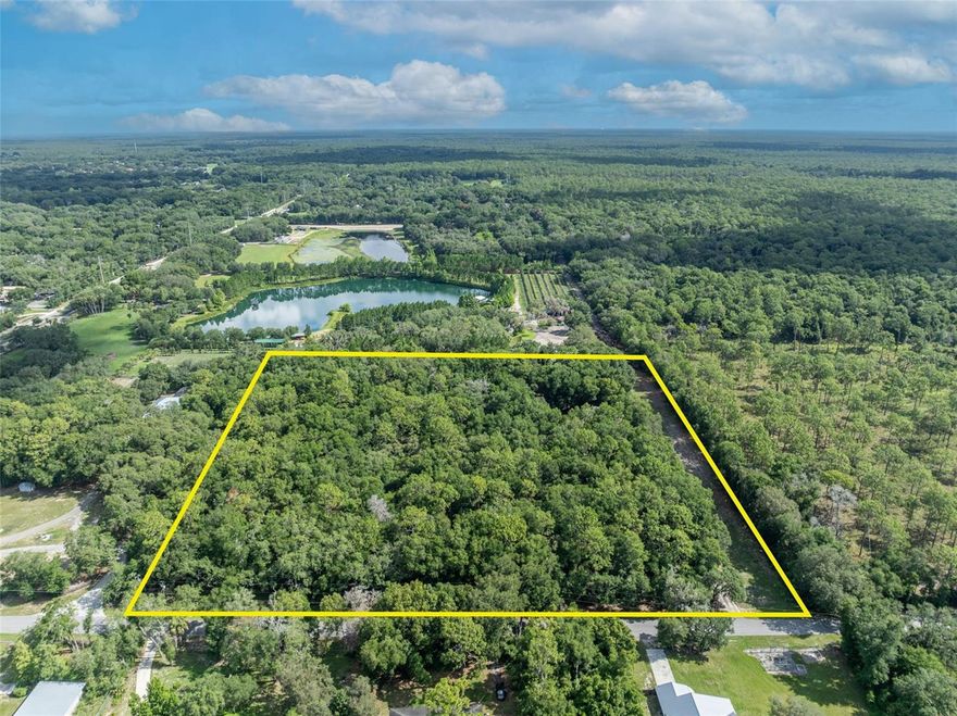 High and dry 9.58 acres of beautiful wooded property. Currently zoned A-2 and located in the Wekiva River Protection area.  If kept under A-2 density would allow 1 dwelling every 5 acres.    Gated private entrance with paved driveway.  Electricity, Water, Propane, RV hook up & 22 Kw generac generator connected on property.  Free viable 1895 sqft structure on property.  Property has no wetlands nor in a flood zone.