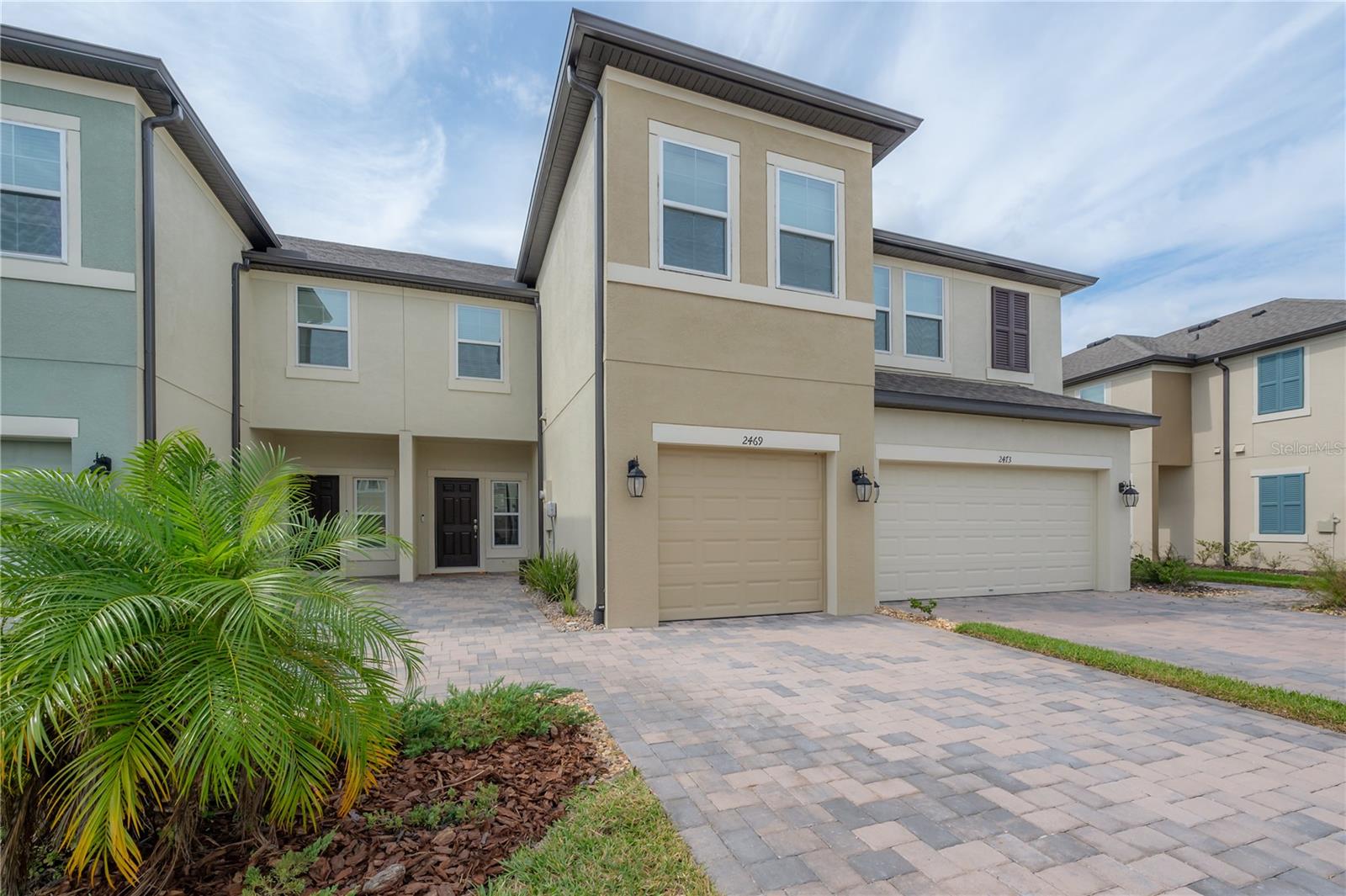 Motivated seller! All reasonable offers will be considered. Welcome to your dream townhome in the heart of Wesley Chapel! This luxury residence, built in 2022, features impeccable upgrades throughout. The open-concept layout is highlighted by modern metal stair railings and a sleek farmhouse sink in the gourmet kitchen, which is equipped with slow-close hinges and adorned with elegant bronze accents. High-end appliances, including the refrigerator, range, and dishwasher, come with a 5-year warranty, ensuring peace of mind. The primary suite offers a spa-like retreat with double sinks and a stunning glass shower enclosure. Thoughtful touches like a soft water loop and a 10-year structural warranty add to the home's appeal, while the new roof, HVAC, and water heater provide top-notch efficiency. The home is also equipped with a Clare One home security system that seamlessly connects exterior lights, the garage door, and door sensors, plus a Nest doorbell for added security. Located in one of Wesley Chapel’s most desirable communities, you'll enjoy access to premium amenities like a swimming pool, cabana, and a serene pond, creating the perfect setting for evening sunset strolls. The community also boasts top-rated schools and convenient shopping and dining options just minutes away. With easy access to major highways, you’re just a short drive from the vibrant culture and dining of downtown Tampa. Experience a blend of luxury, convenience, and vibrant community living in this exquisite townhome!