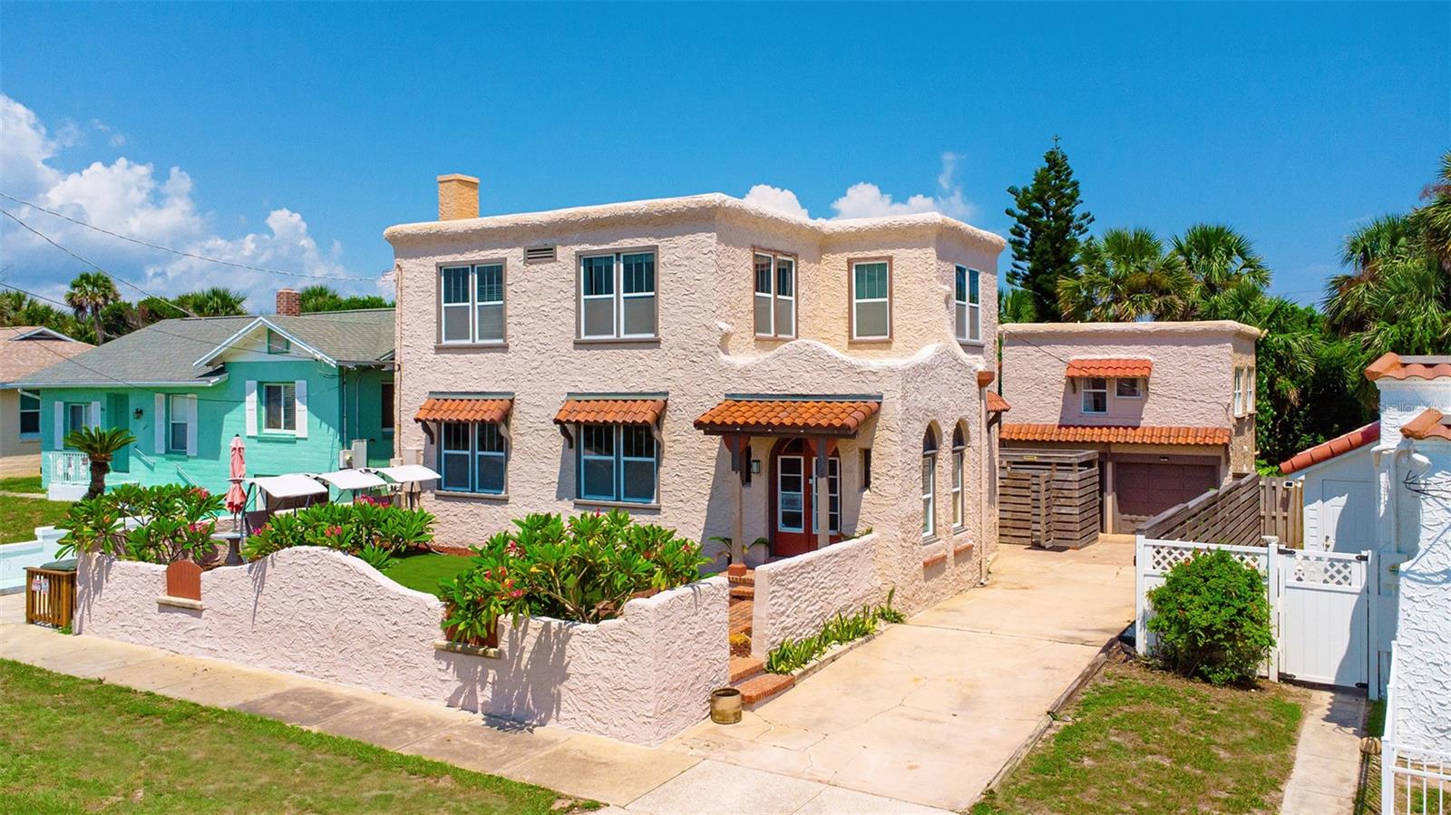 Discover a rare opportunity to own a piece of timeless elegance at 529 Hillside Avenue in Daytona Beach. This extraordinary Mediterranean-style multifamily estate blends historic craftsmanship with modern luxury, offering both versatility and sophistication in one remarkable property. Spanning 2,400 square feet, the home features a three-bedroom, two-and-a-half-bath main residence complemented by a private one-bedroom, one-bath apartment — perfect for extended family, distinguished guests, or a refined rental suite. From the moment you arrive, the solid wood Spanish door, with intricate detailing, sets the tone for the exceptional architecture within. Inside, original hardwood flooring, a stunning fireplace, and a sunroom filled with natural light from upgraded windows create a warm yet elegant atmosphere. The modernized kitchen is both functional and beautiful, with updated finishes designed for today's lifestyle. Bathrooms have been meticulously renovated with designer tile work and spa-inspired details, offering a retreat-like experience. The property's historic character is balanced seamlessly with upgrades that bring comfort and ease, preserving its heritage while embracing modern living. Step outdoors to your own private resort-style oasis, where a dry pool deck and sparkling swimming pool invite both quiet relaxation and vibrant entertaining. A two-car garage and downstairs laundry complete the home with everyday convenience. Situated in a prestigious Daytona Beach location, you're just minutes from the shoreline, fine dining, boutique shopping, and the world-renowned Daytona International Speedway. Whether you're seeking an architectural masterpiece with investment potential, a multigenerational retreat, or a luxurious coastal escape, 529 Hillside Avenue offers an unmatched blend of history, elegance, and opportunity. This is more than a home; it's a statement of style and sophistication. Don't miss your chance to own this Mediterranean jewel in one of Florida's most iconic coastal cities. By appointment only. No owner financing.