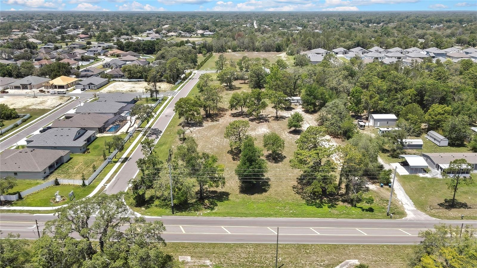 Almost 4 Acres of land zoned Commercial/Multi-Family in a prime location. 2.46 Acres Zoned Multi-Family. 1.39 Zoned Commercial. Suncoast Parkway is approximately 1 mile away! There is a mobile home on the property that was partially remodeled a year ago (some new flooring, drywall, countertops, cabinets, roof resealed). Daily traffic count of 25,000. Don't miss this fantastic investment opportunity!