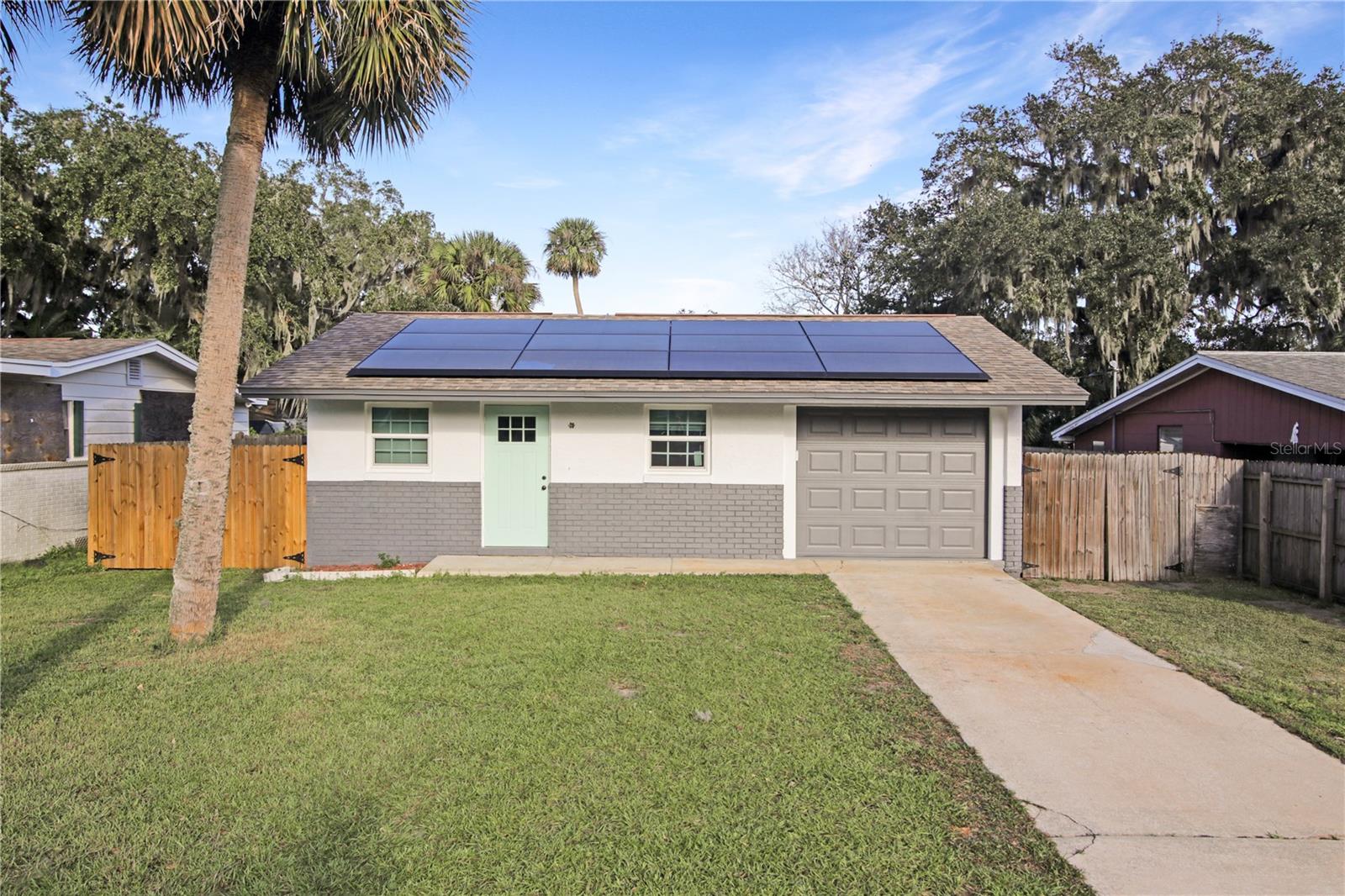 Modern, Energy-Efficient, and Full of Charm Welcome to this beautifully updated 3-bedroom, 1-bath home in the heart of Edgewater! Perfectly designed for comfortable living, this property features a smart layout that maximizes every square foot, making it ideal for cozy evenings or lively gatherings. This home stands out with its state-of-the-art Tesla Solar Energy System, delivering incredible energy savings while embracing a sustainable lifestyle. In 2023, brand-new windows were installed, adding a modern touch and filling the space with natural light while improving energy efficiency. Step outside to a spacious backyard. The property has been lovingly maintained and has endured Florida’s toughest weather with zero hurricane damage—a testament to its quality and resilience. Charming, efficient, and move-in ready, this home is perfect for first-time buyers, downsizers, or anyone seeking a blend of modern upgrades and worry-free living. Seller is motivated and may entertain buyer credits! Book your showing today—you won’t want to miss this one!