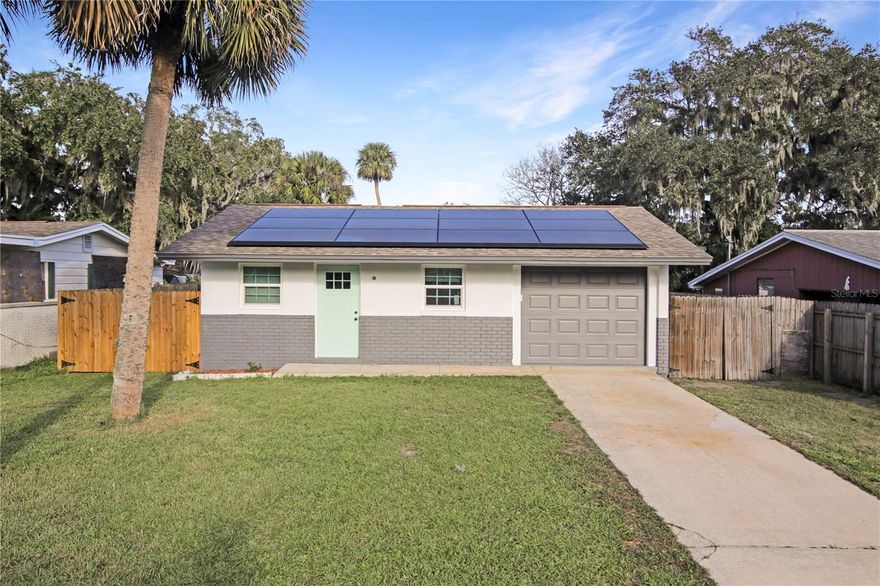 Modern, Energy-Efficient, and Full of Charm Welcome to this beautifully updated 3-bedroom, 1-bath home in the heart of Edgewater! Perfectly designed for comfortable living, this property features a smart layout that maximizes every square foot, making it ideal for cozy evenings or lively gatherings. This home stands out with its state-of-the-art Tesla Solar Energy System, delivering incredible energy savings while embracing a sustainable lifestyle. In 2023, brand-new windows were installed, adding a modern touch and filling the space with natural light while improving energy efficiency. Step outside to a spacious backyard. The property has been lovingly maintained and has endured Florida’s toughest weather with zero hurricane damage—a testament to its quality and resilience. Charming, efficient, and move-in ready, this home is perfect for first-time buyers, downsizers, or anyone seeking a blend of modern upgrades and worry-free living. Seller is motivated and may entertain buyer credits! Book your showing today—you won’t want to miss this one!