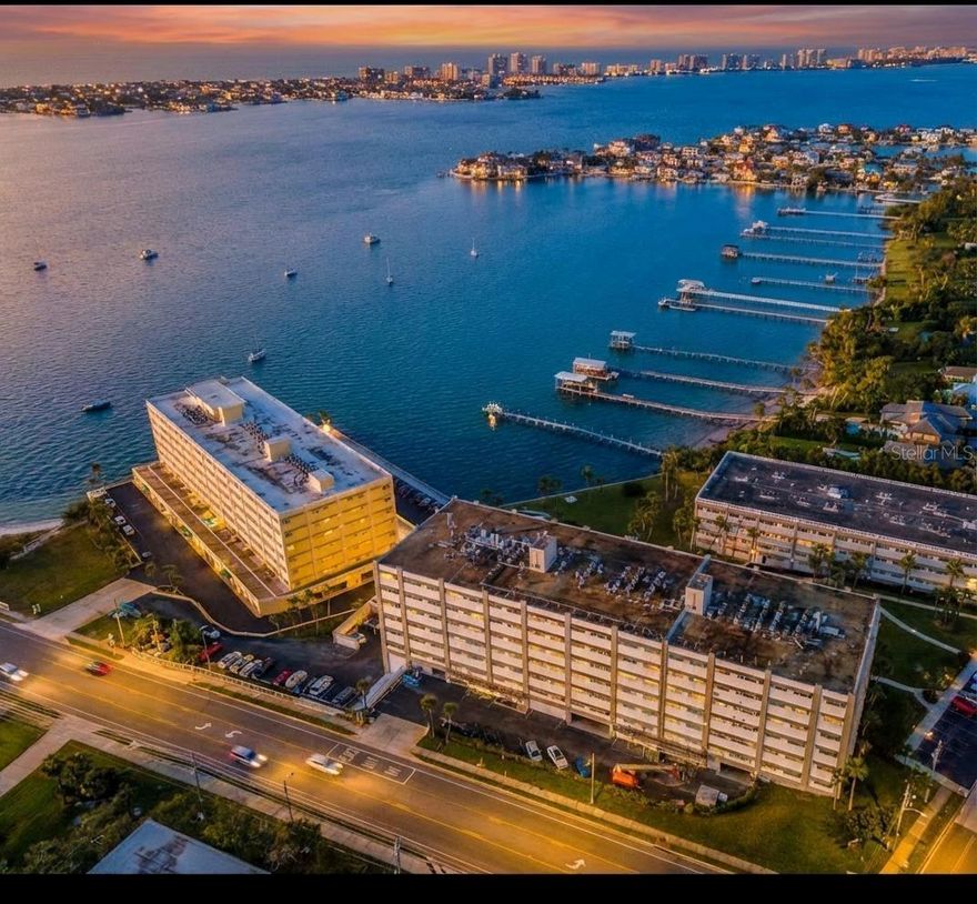 Invest with confidence in this well maintained one-bedroom condo, located in the well constructed building of Harbour Club C—a community known for its exceptional financial stability and good HOA  management. This bright and spacious condo features stunning water views of the Intracoastal and Clearwater Bay, creating a serene backdrop for daily living. The large primary bedroom includes a walk-in closet and a luxurious ensuite bathroom with spacious vanity and a walk-in shower. A separate den/office offers flexible space for guests, remote work, or quiet relaxation—plus a generous storage closet for added convenience. The kitchen has good work flow with ample cabinet space, a pantry,  and expansive countertops—perfect for everyday cooking or entertaining. A second full bathroom with a tub provides extra comfort for guests. Enjoy resort-style amenities, including a heated pool, fishing dock, BBQ area, and shuffleboard courts, all just a short stroll from beaches, shopping, and top-rated restaurants. Best of all, this unit had no storm damage and is truly move-in ready. Recent 2023–2024 building upgrades, including a new roof, fresh exterior paint, and updated interior carpets, reflect the board’s commitment to long-term upkeep—all with FULLY FUNDED, reasonable HOA fees and building FLOOD INSURANCE, Cable and Internet  is INCLUDED in your HOA . The Milestone Inspection and Reserve Study have been completed, giving added peace of mind to owners and investors alike. A recent increase in availability reflects several original owners choosing to sell around the same time—not any building or HOA concerns—creating a rare opportunity to purchase in this tightly held waterfront community .A recent increase in availability reflects several owners choosing to sell around the same time—not any building or HOA concerns—creating a rare opportunity to purchase in this tightly held waterfront community. Recent building upgrades further enhance its appeal and stability.  Whether you’re looking for a full-time residence, seasonal escape, or smart investment, this condo offers peace of mind, lifestyle, and location—This is a fantastic opportunity to own in a million-dollar neighborhood at an affordable price. With just a few simple updates, this home can truly shine. The virtually enhanced wall color highlights how a small change can make a big impact and allows buyers to envision adding their own personal touch.” 
Contact your Realtor today or reach out to schedule a private showing. This is Florida living at its best—secure, scenic, and smart.