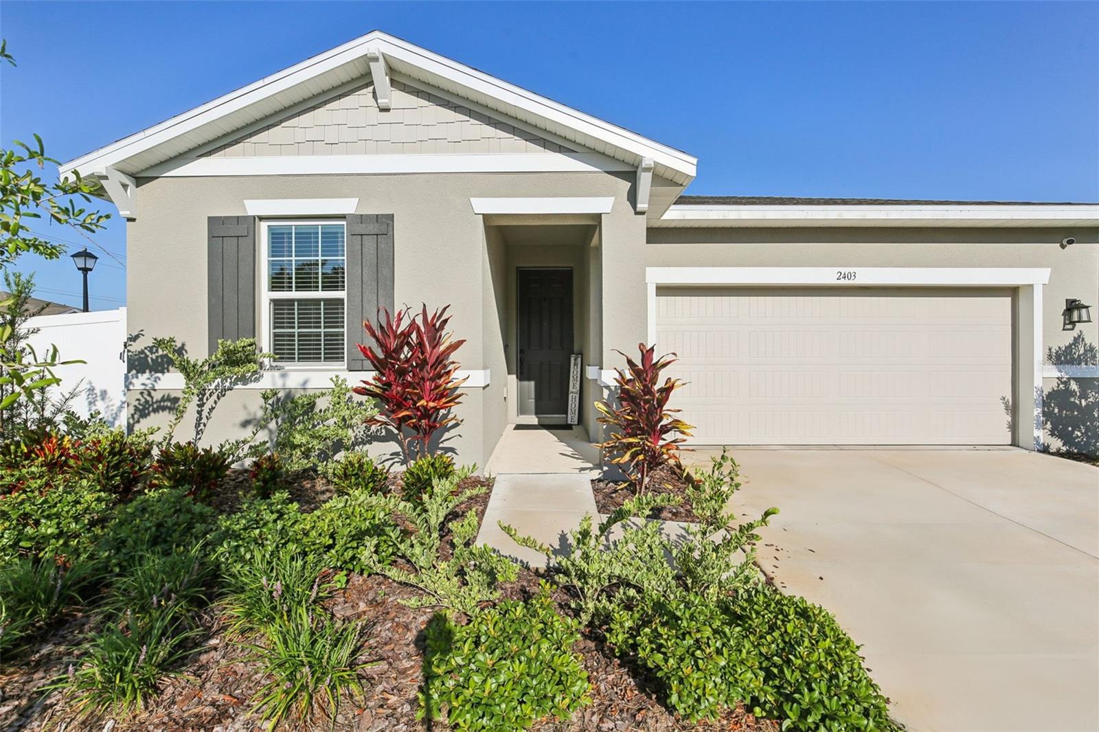 Welcome to 2403 Charley Rd – a beautifully upgraded, model-style home in a vibrant new construction community! Perfectly positioned on a corner lot in a peaceful cul-de-sac, this stunning 3-bedroom, 2-bath home is just steps from the community pond, offering both tranquility and convenience. It truly shows like the builder’s model—but with thoughtful upgrades that set it apart from the rest. This home has been seasoned with love while still providing that fresh, new construction feel. Enjoy a fully fenced yard, high-end front loader washer and dryer, a whole-home water softener system, and stylish finishes throughout. The bright open floor plan includes a spacious kitchen, split-bedroom layout, and an inviting living space perfect for everyday life and entertaining. Eligible for USDA financing. Located near some of Central Florida’s most beloved landmarks—including Bok Tower Gardens, Legoland Florida, and Orlando International Airport—this home combines modern comfort with unbeatable location. Schedule your private showing today and fall in love with 2403 Charley Rd!