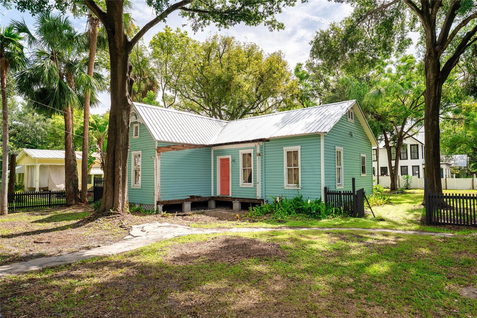 Your opportunity to restore a piece of Tampa history is here.
This bungalow in the heart of Historic Tampa Heights has been completely gutted to the studs and is ready for your vision. Located on a deep,
oversized corner lot along one of the neighborhood’s most iconic corridors, Central Avenue, the location offers both charm and convenience.
Enjoy the quiet, tree-lined streets just steps from community favorites like Lee’s Grocery and the Tampa Heights Community Garden, while being
minutes from Ybor City, Downtown Tampa, and the Riverwalk.
The expansive lot provides plenty of room for a future garage or accessory dwelling unit (ADU).
Important updates already completed include a new electric panel (2024), roof (2016), water heater (2023), and a custom
fence with electric gate (2024).
Please note: This home is a contributing structure within both the local and national Tampa Heights Historic Districts. As such, it cannot be
demolished and any exterior modifications must be reviewed and approved by the City of Tampa’s (ARC) or its staff.