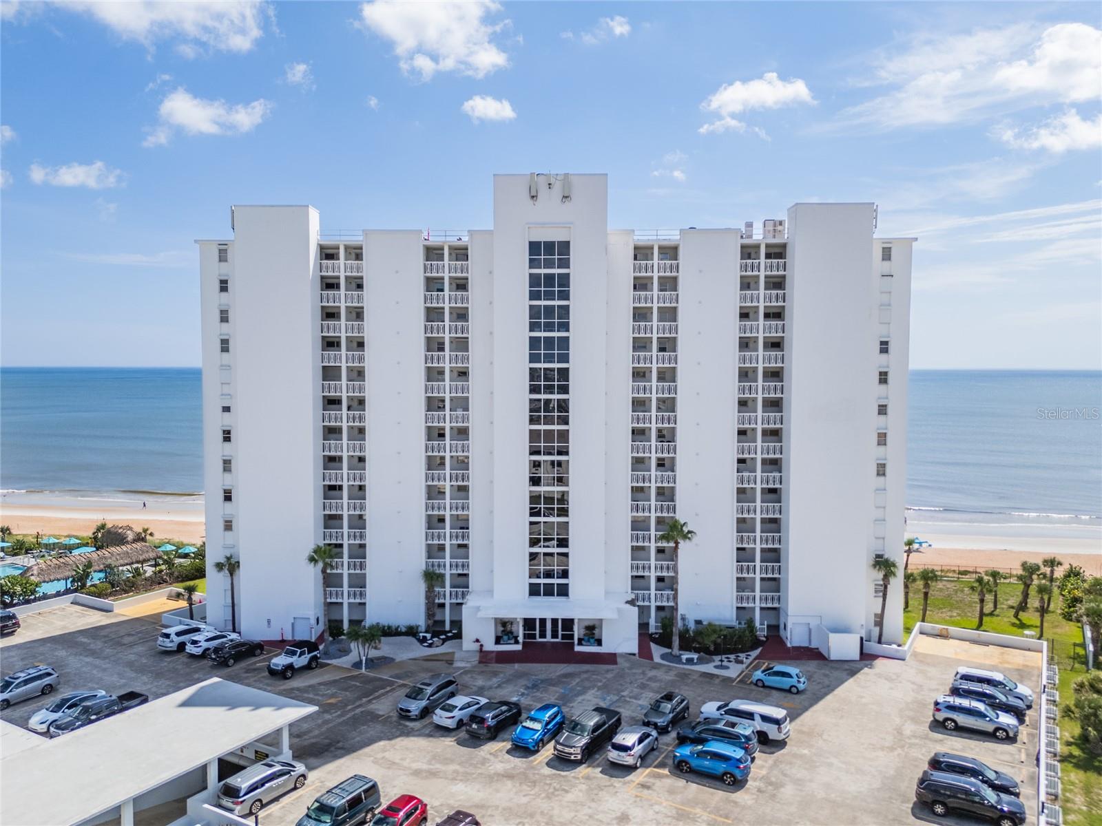 Experience breathtaking, unobstructed ocean views from this elegant 2-bedroom, 2-bathroom direct oceanfront residence, located on the 11th floor of the highly desirable Van Lee condominium. This beautifully maintained unit features tile flooring throughout and two fully renovated bathrooms (2020) with custom-tiled showers, modern vanities, updated fixtures, and new toilets. The kitchen has been tastefully updated with sleek Corian countertops and newer cabinetry, opening seamlessly to the dining and living areas—perfect for both entertaining and everyday coastal living. Wake up to panoramic Atlantic views from the spacious primary suite, complete with a walk-in closet and a private ensuite bath. A newer A/C system (2019) ensures comfort year-round. Van Lee offers resort-style amenities, including a beachfront pool with paver sun deck, two elevators for convenience, private laundry for each unit, an exercise room, library, garage parking, and flexible rental policies with no restrictions on rental frequency—ideal for investors or those seeking income potential. This is truly oceanfront living at its finest.