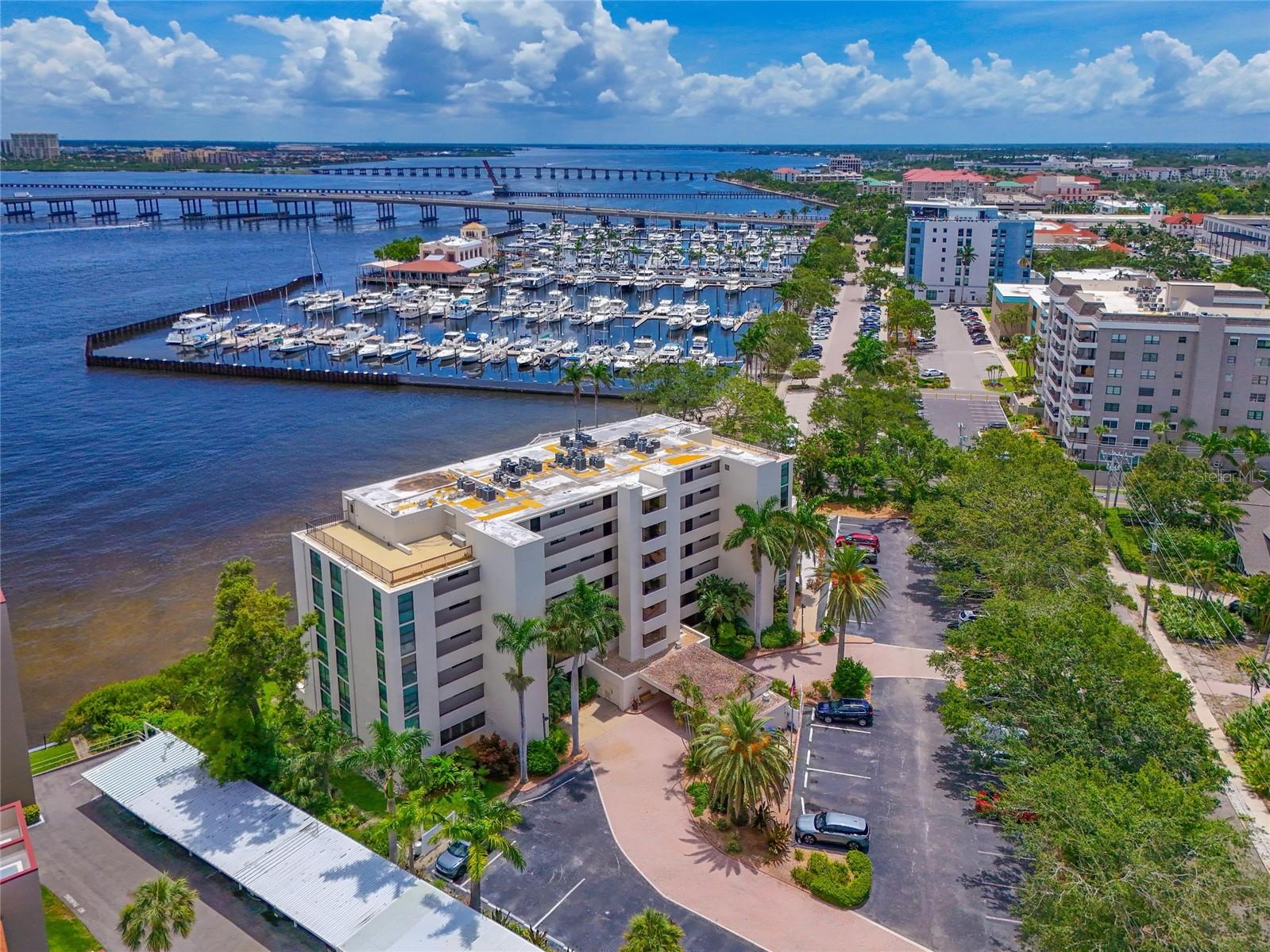 Direct Waterfront Condo with Stunning Panoramic River Views.
If you're seeking an alluring ambiance paired with exceptional waterfront living, look no further—this beautifully remodeled 2-bedroom, 2-bath condo is the one. Perfectly positioned in a direct waterfront location, it boasts unobstructed, panoramic views of the Manatee River from the great room, kitchen, dining, master suite, and the oversized outdoor Veranda. Step inside and feel immediately at home in the warmth and character of this thoughtfully renovated residence. The open-concept great room is anchored by luxury vinyl plank flooring, designer lighting, and stylish accent wall, creating a welcoming and modern space for relaxing or entertaining. The gourmet kitchen is both beautiful and functional, featuring quartz countertops, stainless steel appliances, a double oven range, tile backsplash, tray ceiling, recessed lighting, and plantation shutters—all elevated by elegant finishes and attention to detail. The spacious master bedroom offers breathtaking water views and access to an ensuite bath with quartz countertops, showcasing high-end flooring, framed mirror, seamless glass shower doors, and dual closets. The guest bedroom and bath are equally refined with upgraded tile, plantation shutters, framed mirror, and generous closet space. There is additional living space in an enclosed lanai area that opens through sliders to the extended outdoor living space of the Veranda. Additional features include a stackable washer/dryer, impact-resistant front windows, new tile on Veranda and a 2023 AC unit. HOA fees cover water, sewer, trash, cable TV, and WiFi—adding ease to a maintenance free lifestyle. Outdoor enthusiasts will love the direct shoreline access, ideal for fishing or launching a kayak. A fishing kayak is included and kayak storage is conveniently located under the pool deck. The complex also offers a private beach, plus resort-style amenities: pool, spa, clubhouse, sauna, billiards, and a scenic water gazebo. Situated on the west end of the Riverwalk, you’re just steps from Twin Dolphins Marina—perfect for boaters—and close to Pier 22 for waterfront dining. Explore the vibrant downtown Bradenton scene, enjoy the weekly Farmers Market, or take a short drive to the world-class beaches of Sarasota, Bradenton, St. Pete, and near by Anna Maria Island. With easy access to both Sarasota and Tampa airports, this location is as convenient as it is captivating.