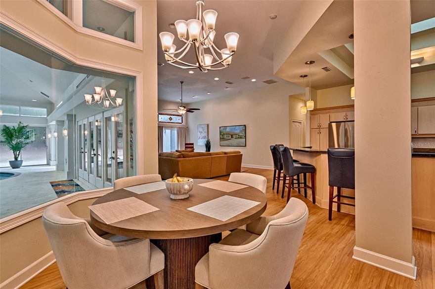 Looking for one of the most unique homes in Gainesville?  This is a must see!  Built by Dublin builders and remodeled by EG Gonzales in 2017 in the wonderful neighborhood of Benjamin's Grove in Haile Plantation. This home features an indoor pool that can be seen from most rooms in the house!  With the indoor pool area that is heated and cooled, it's never too bad weather to enjoy a good swim.  Driving up on the circle drive will impress with grand curb appeal where you will notice new plantation shutters in every window in this home. When you enter through large double arched solid wood doors into the foyer overlooking the pool, it is sure to please. On the right side of the foyer, you will find a very spacious luxury kitchen.  The fantastic features of the kitchen include gas cooktop, double oven, wine frig, elevated dish washer to save your back, two sinks with expansive island bar top.  Just off the kitchen is a large breakfast nook looking out over the pool through seamless glass to enjoy the view.  The open living room has great views of the pool area and right off the kitchen for a great space for the fun, family and friends get togethers you will have.  By the foyer is the formal dining room that will hold a very large table for all of your holidays and special occasions.  Heading to the other side of the foyer you will find a great office space with a view of the well landscaped front yard and circle drive.  Continuing beyond the office is a half bath that leads to a hallway to the main bedroom.  In the main bedroom, you will love an oversized room to hold your king-sized bed and lots of bedroom furniture with an electric fireplace.  The main bathroom features a really nice walk-in shower, big soaking tub for the tougher days, dual vanity and two oversized walk-in closets.  The other side of the home you will find the guest bedrooms that are very good size that all have new wood plank floors that family and guests alike will love spending time here.  The main feature is the indoor pool that was converted to a salt system less than two years ago. With four new skylights above you will enjoy the natural light without getting burned and it has a new HVAC to keep it perfectly comfortable all the time.  There is plenty of room around the pool for tables and chairs to host larger parties for fun in this unique atmosphere.  Going into the backyard there are new pavers that expand across the length of the home with a hot tub on one end to enjoy clear nights under the stars.  The backyard was fenced less than two years ago to keep man's best friend close by.  A firepit is there as well for the cooler nights you want to be outside.  Coming back inside you will enjoy an oversized laundry room with new washer and gas dryer.  To finish this wonderful home out you have an oversized three car garage.  All items that are two years or less are the plantation shutters, salt system in pool, HVAC in pool area, pavers across the back of the home, four hurricane skylights in pool area and five more throughout the home, floors in additional bedrooms, the fence and hot tub.  This home is absolutely move in ready!