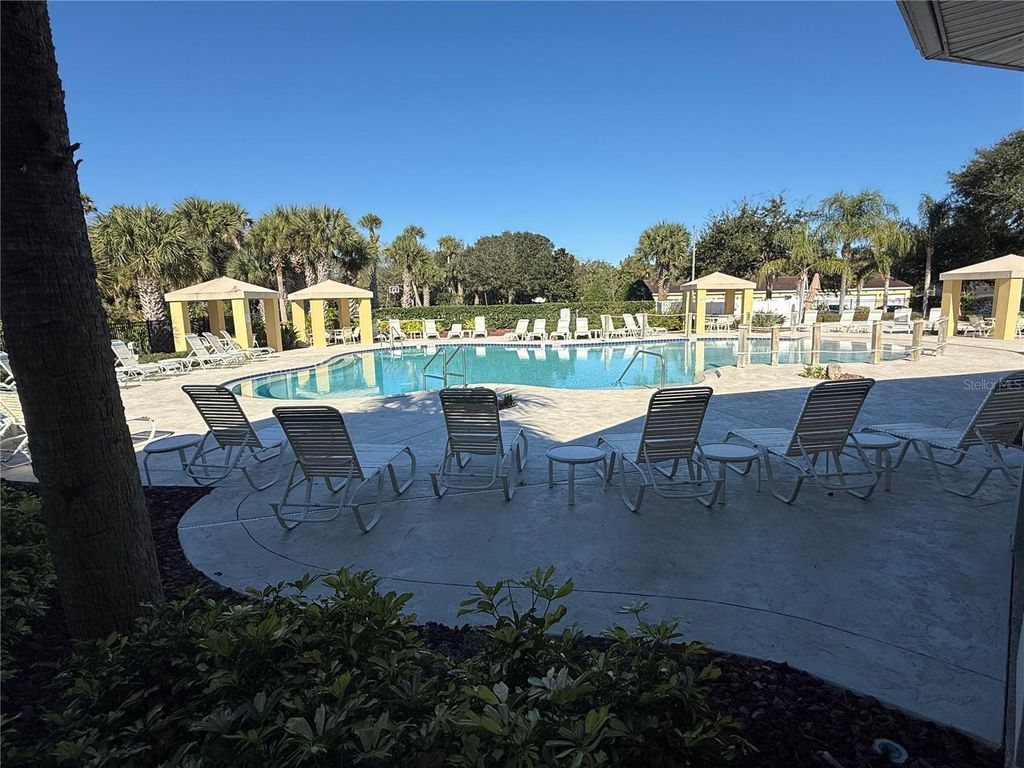 Photo of 200 Canopy Walk Ln #242, Palm Coast, FL 32137 (MLS # FC314977)