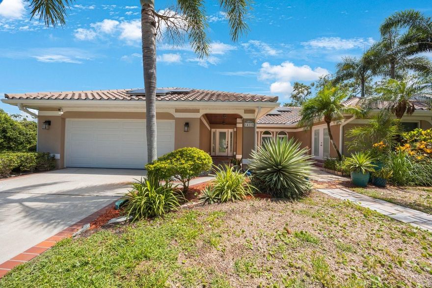 Located in desirable Kensington Oaks, this exceptional 3 bedroom, 3 bath, 2 car garage pool home sits on a park-sized corner lot of nearly half an acre. A rare bonus feature is the detached climate-controlled 3 car garage complete with 2 lifts — perfect for car enthusiasts, hobbyists, or additional storage with separate driveway access. Inside, the spacious split-bedroom floor plan offers vaulted ceilings and expansive living areas designed for both comfort and entertaining. The kitchen features granite countertops, double ovens, stainless steel appliances, and ample cabinetry. The inviting family room includes a wood-burning fireplace and dry bar, creating a warm and welcoming atmosphere. Travertine flooring runs throughout most of the home, with two bedrooms featuring waterproof luxury vinyl flooring. The oversized primary suite offers a separate private sitting area with wall of windows and Frenchdoors to the pool and a ensuite bath with dual sinks, soaking tub, walk-in shower, and large walk-in closet. Step outside to enjoy the screened lanai with pool and spa, sauna (Sauna not warranted) kitchen area with sink and cabinets, and pool bath.  Perfect setting for relaxing or entertaining year-round. Updates include hurricane windows, whole-home generator, solar panels, resurfaced pool, pool heater, and updated HVAC system. The property also features a sprinkler system for easy lawn maintenance. Kensington Oaks HOA includes garbage, recycling, and yard debris pickup. Conveniently located just minutes from Indian Rocks Beach, shopping, dining, and entertainment.