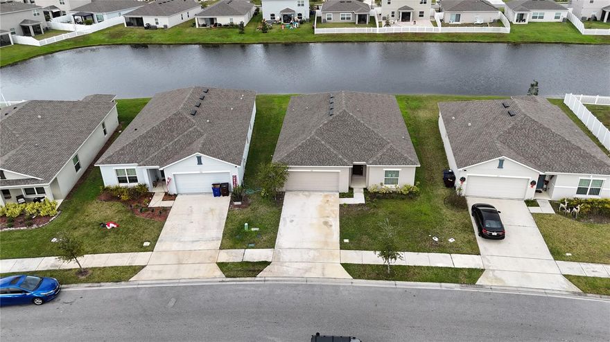 Nearly New Serenity: Premium Pond-View Home in One of St. Cloud's Most Desirable Communities!
Discover the perfect blend of modern luxury and tranquil living in this stunning 3-year-old home—practically brand new, yet available at a fraction of today's new-build prices! Nestled in one of St. Cloud's sought-after neighborhoods, this beauty boasts breathtaking premium pond views that invite peace and relaxation every day.
Step inside to an inviting open-concept design where the gathering room, dining area, and gourmet kitchen flow seamlessly, creating an expansive feel ideal for entertaining or everyday comfort. The well-appointed kitchen shines with a large center island, sleek stainless steel appliances, elegant granite countertops, and ample space for culinary creations.
Fresh updates elevate this home to move-in ready perfection: brand-new carpets in all bedrooms and fresh interior paint throughout. Durable tile flooring graces the foyer, great room, kitchen, and all wet areas for easy maintenance and timeless style.
This thoughtfully designed layout offers 4 spacious bedrooms and 2 full bathrooms. Retreat to the private owner's suite at the rear, overlooking the serene pond—a true oasis with an attached bath featuring dual-sink vanity, walk-in closet, and luxurious shower. The three additional bedrooms, conveniently located near the foyer, provide flexibility for family, guests, or a home office.
Outdoor living is elevated with a covered lanai—perfect for morning coffee or evening gatherings while soaking in those picturesque pond vistas. This home includes desirable structural upgrades like the lanai, plus premium design finishes from the acclaimed Canvas Signature Collection - Overture, known for its modern, fresh aesthetic with crisp whites and deep grays.
Don't miss this rare opportunity to own a like-new gem in a prime St. Cloud location, close to parks, lakes, and all the charm Central Florida offers. Contact us today to schedule your private tour—your dream home with pond-view tranquility awaits!
Buyer is responsible for their own due diligence, including but not limited to verifying HOA information, community rules, square footage, lot size, room dimensions, and taxes.